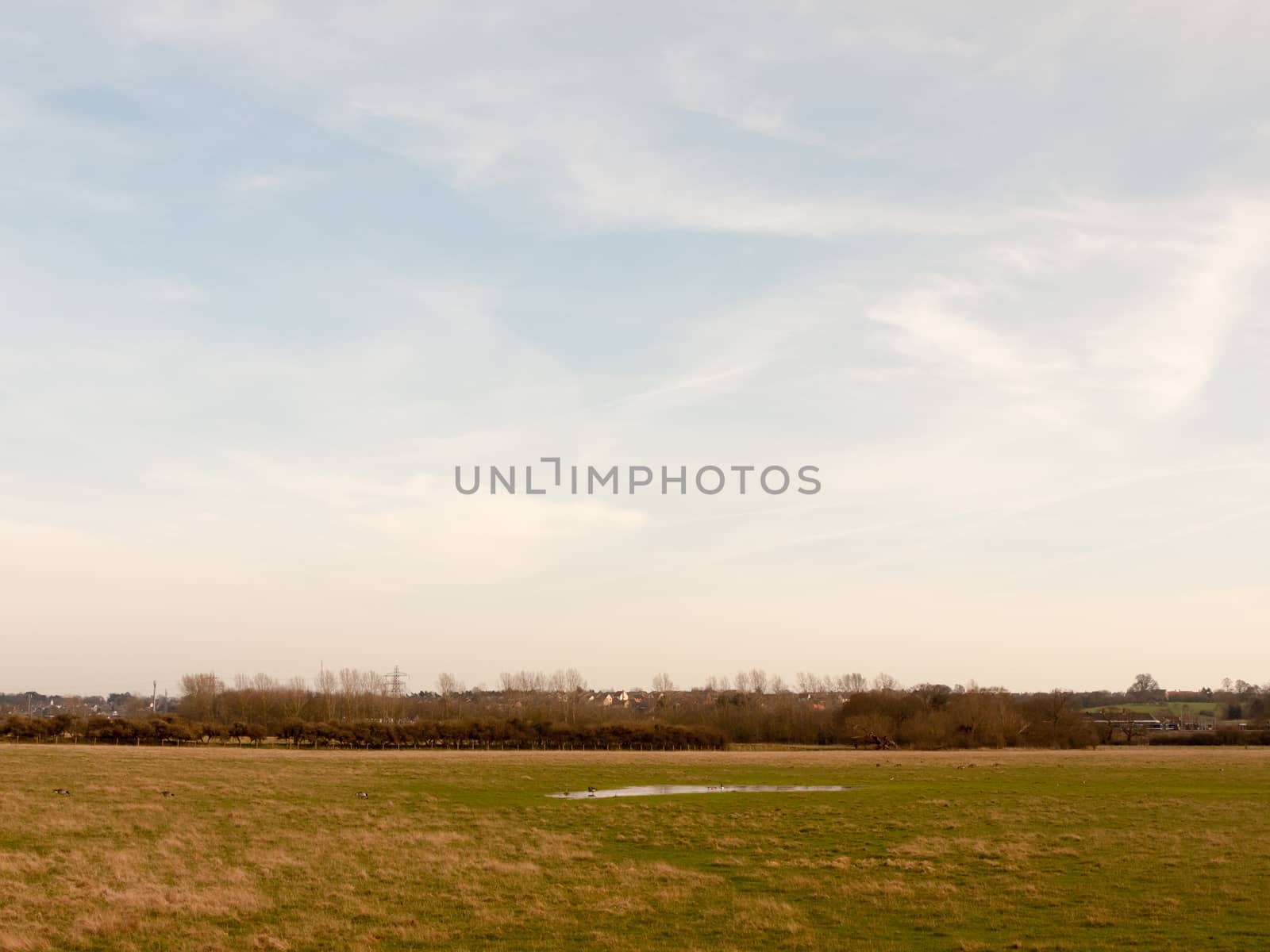 large open farm field empty grass grassland spring sky by callumrc