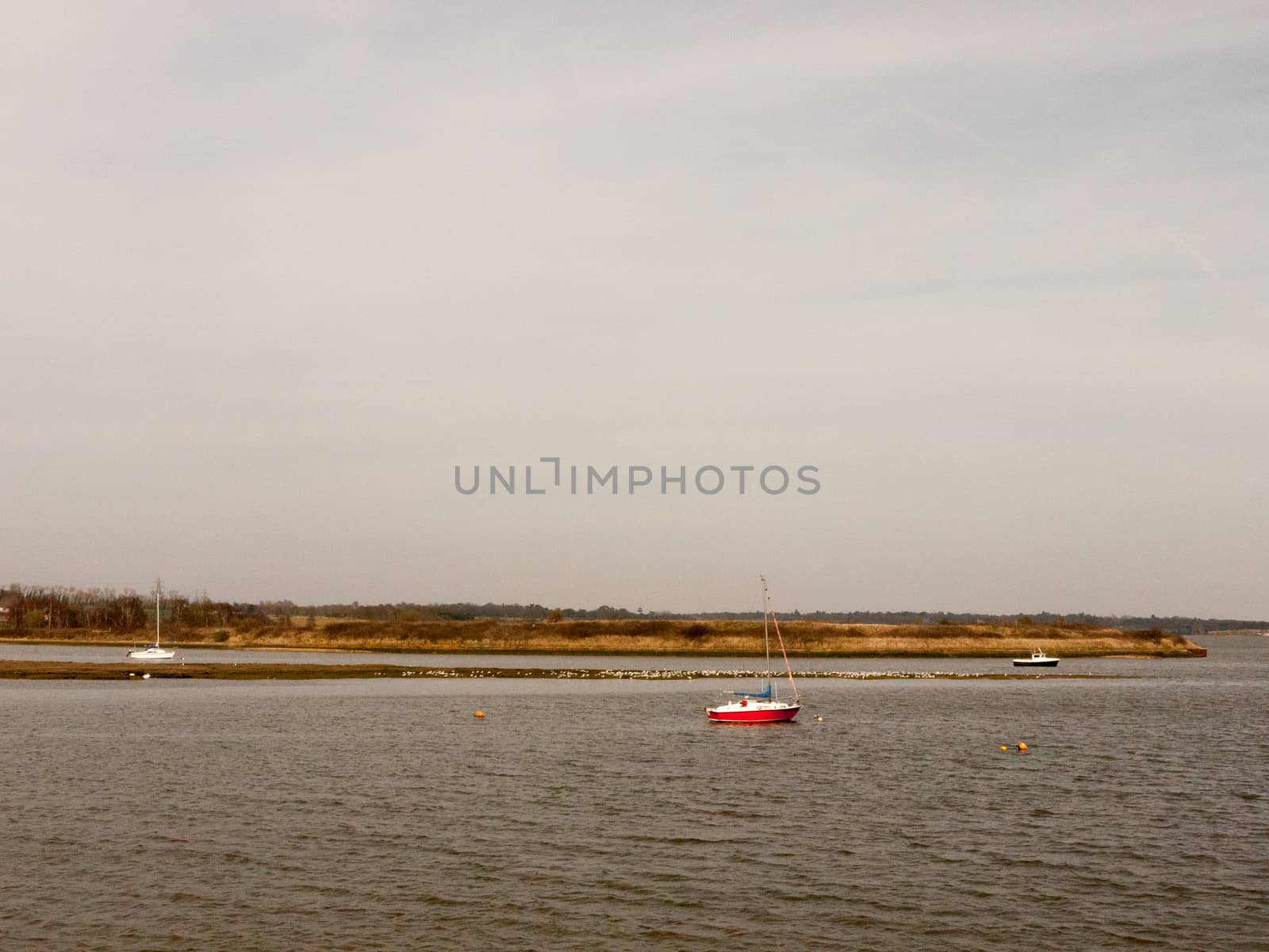 open bay of water spring day overcast boats no people nature background by callumrc