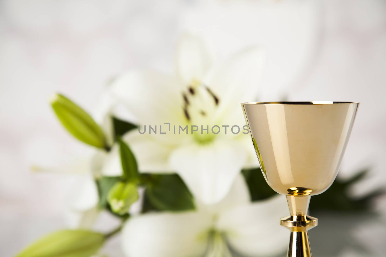 Holy communion a golden chalice with grapes and bread wafers by JanPietruszka