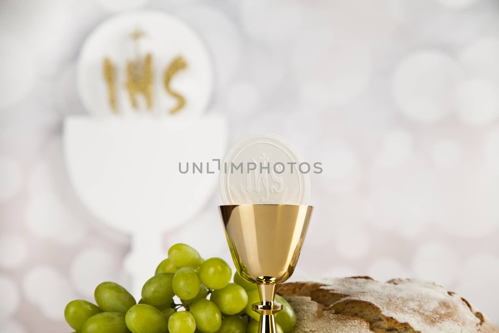 Holy communion a golden chalice, composition isolated on white