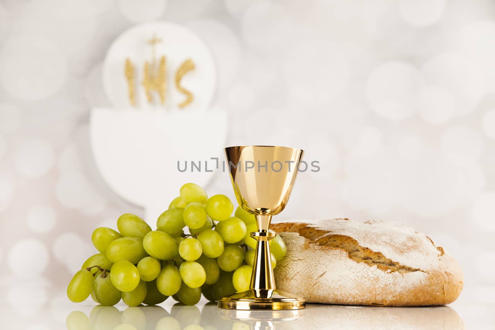 Holy communion a golden chalice, composition isolated on white