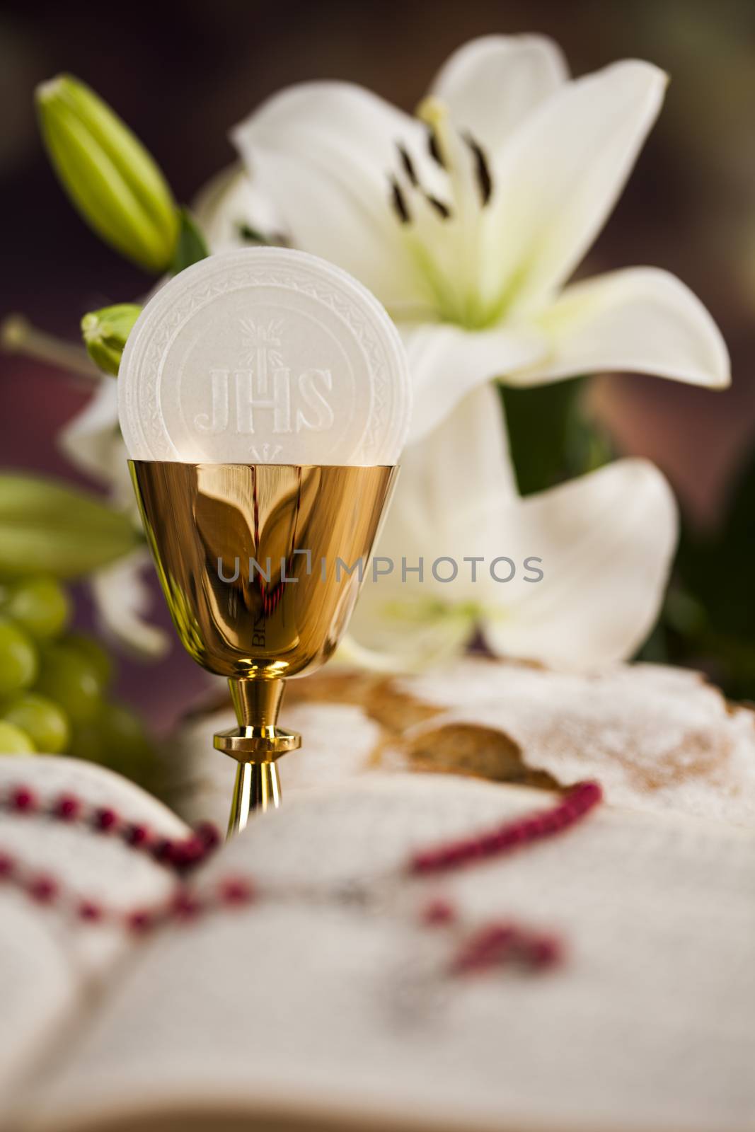 Holy communion a golden chalice with grapes and bread wafers by JanPietruszka