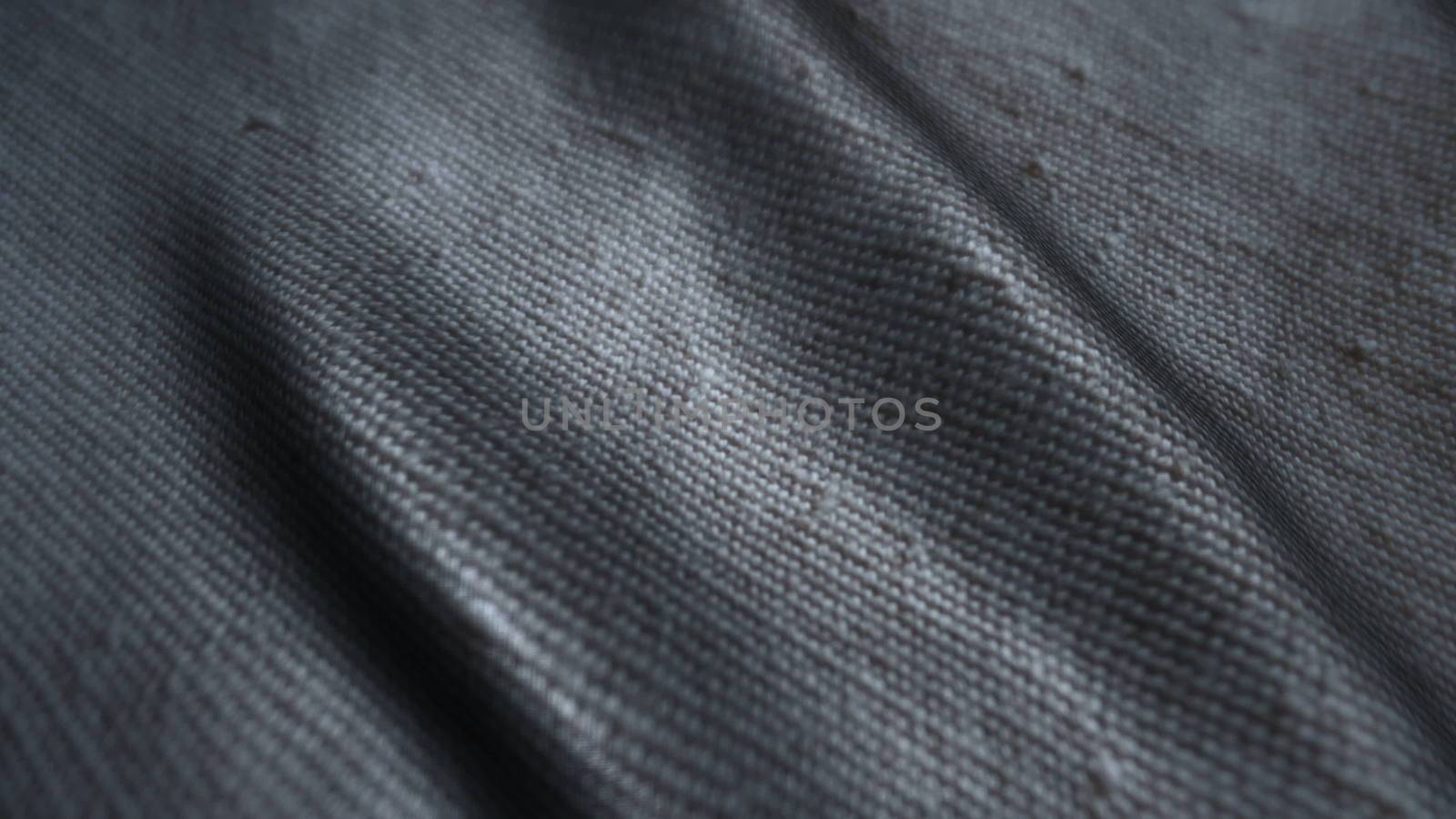 Neutral gray fabric background waving in the wind. Easy to colorize to any color desired by nolimit046
