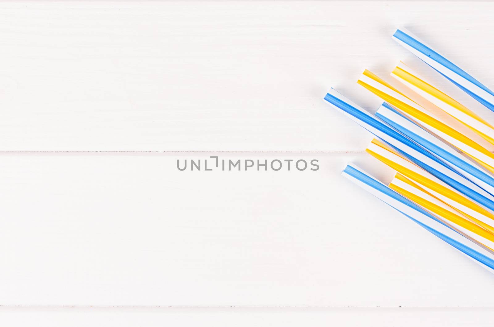 Multicolor cocktail tubes on white background. Close up