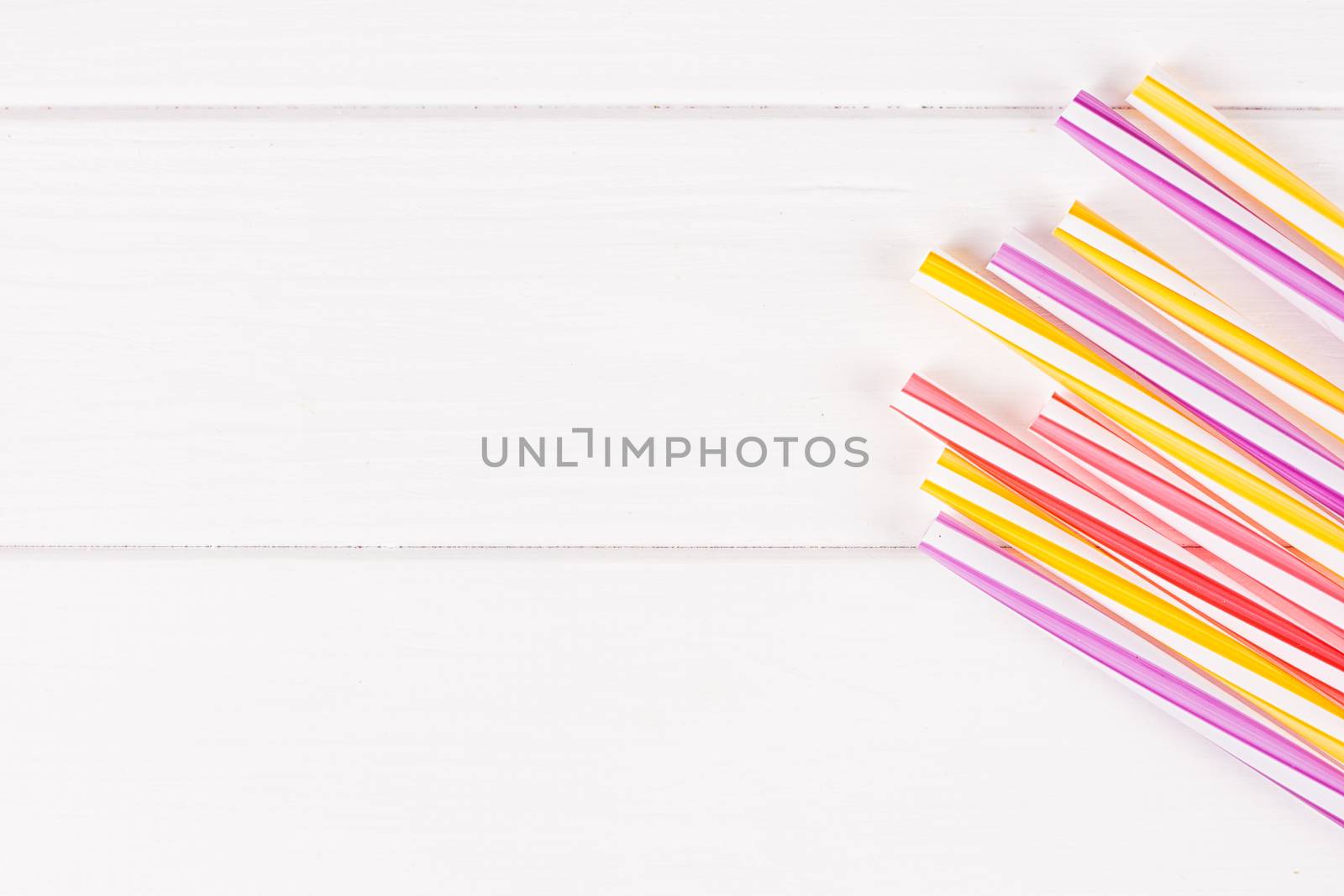 Multicolor cocktail tubes on white background. Close up