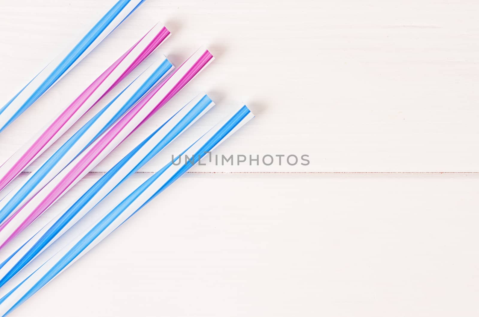 Multicolor cocktail tubes on white background. Close up
