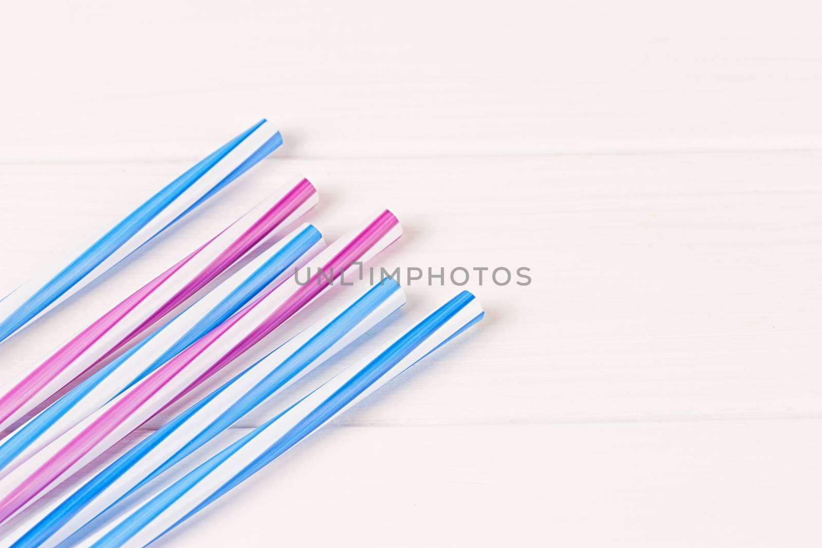 Multicolor cocktail tubes on white background. Close up