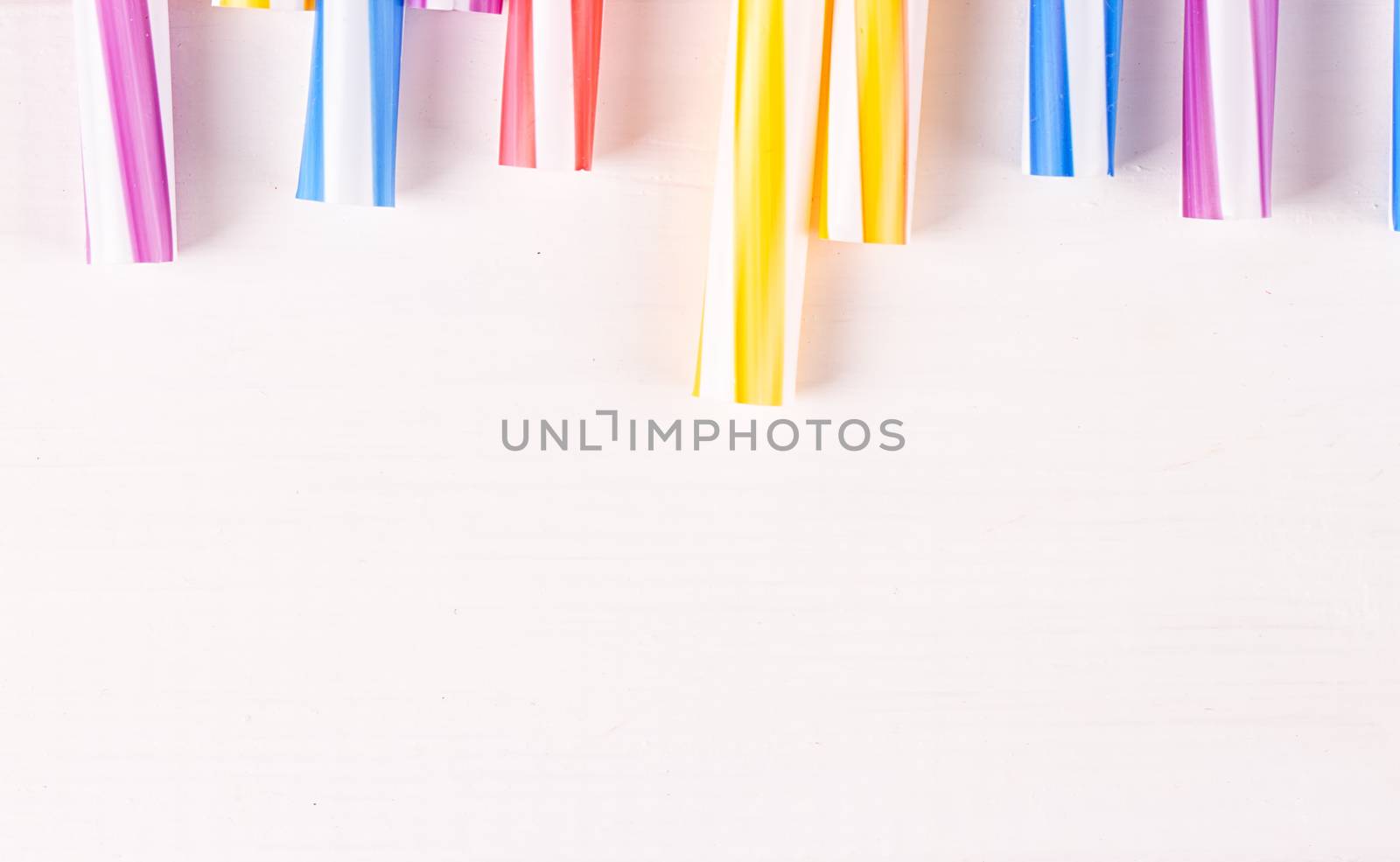 Multicolor cocktail tubes on white background. Close up