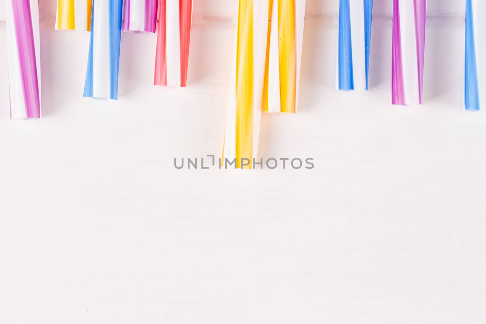 Multicolor cocktail tubes on white background. Close up