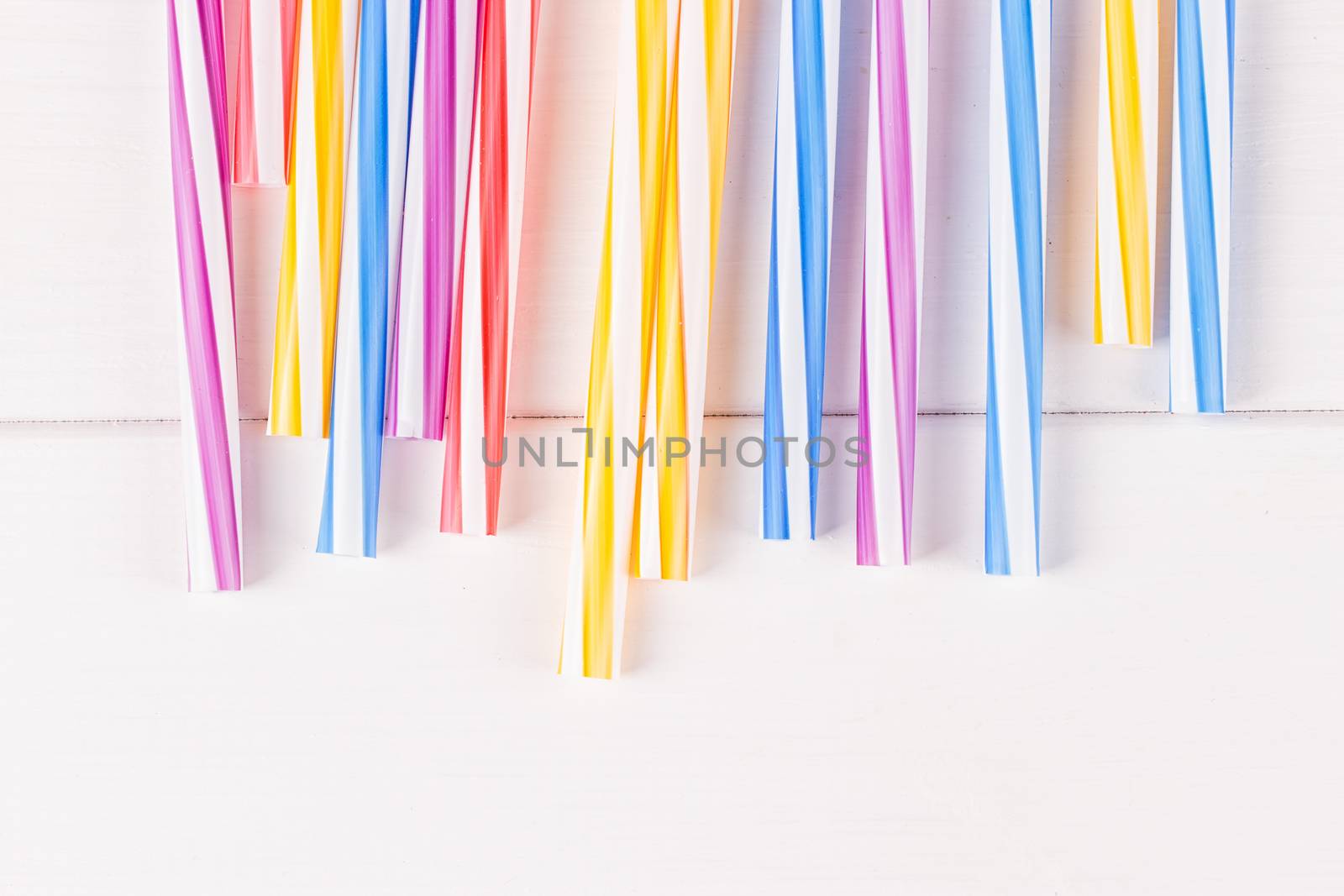 Multicolor cocktail tubes on white background. Close up