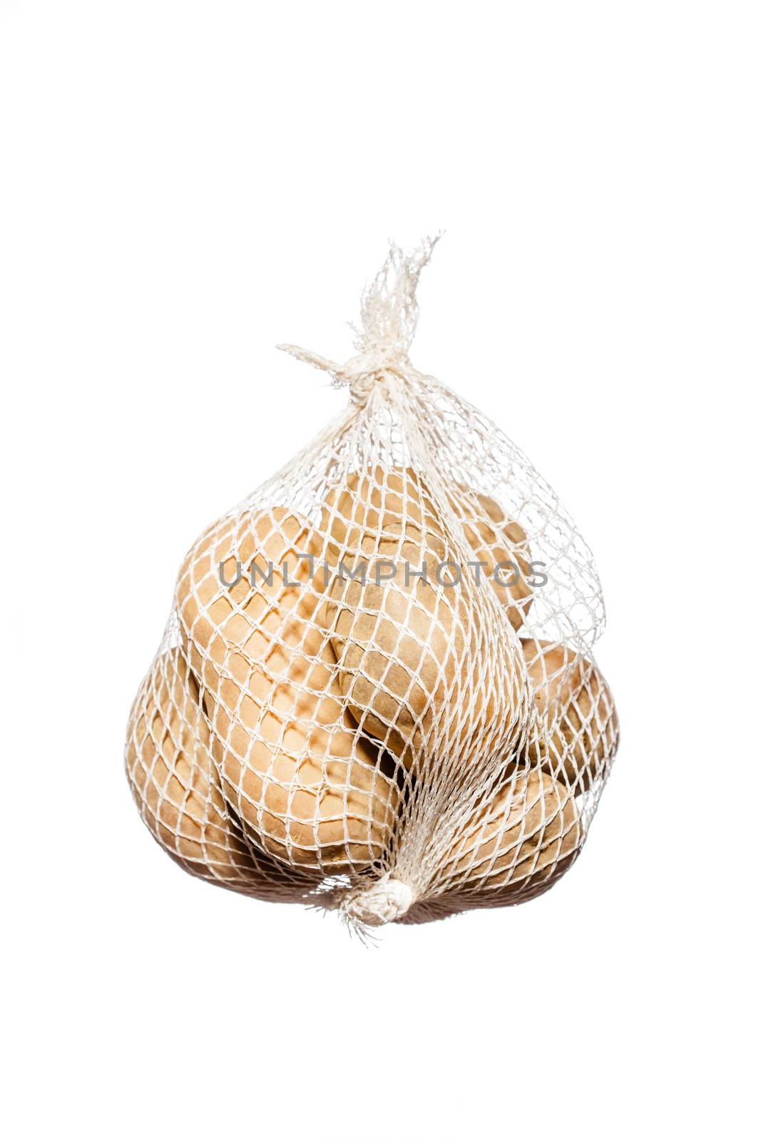 bunch fresh potatoes in a white mesh bag