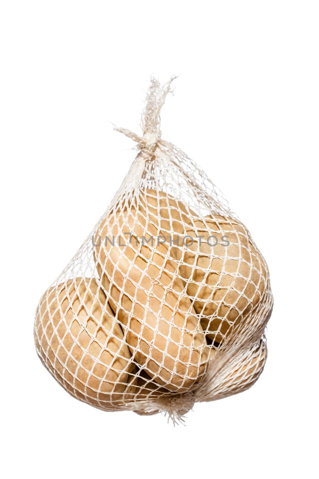 bunch fresh potatoes in a white mesh bag