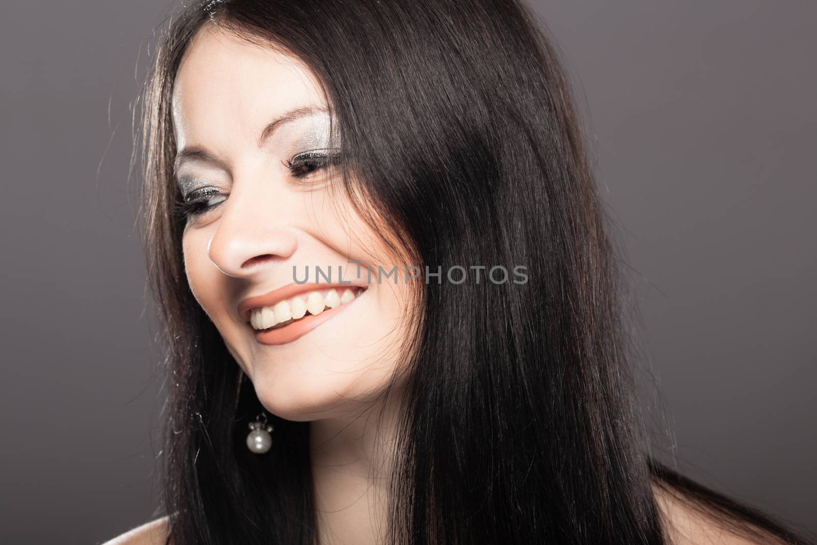 studio portrait of a beautiful brunette girl