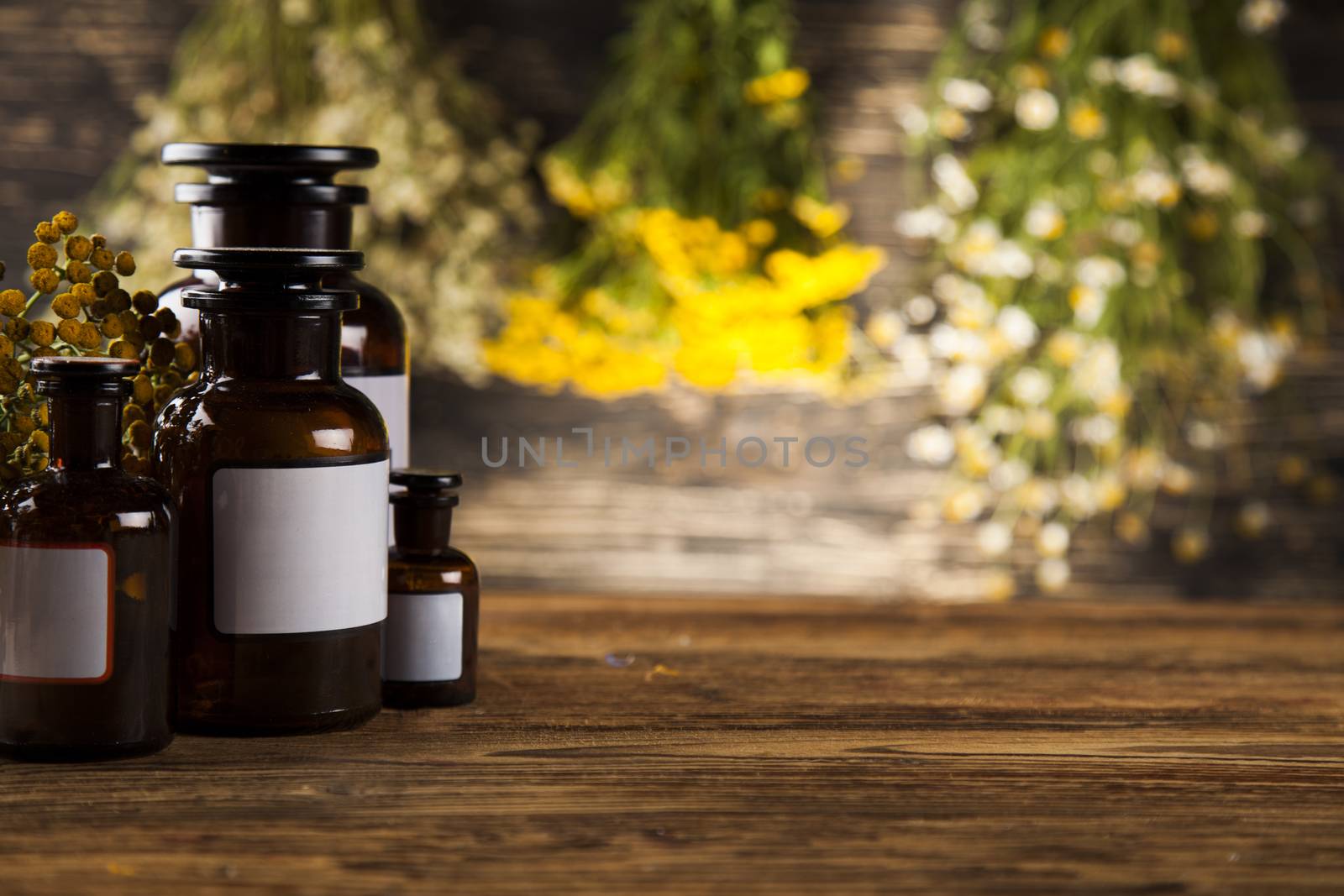 Natural medicine on wooden table background by JanPietruszka