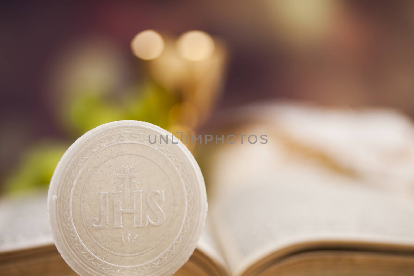 Holy communion a golden chalice with grapes and bread wafers by JanPietruszka