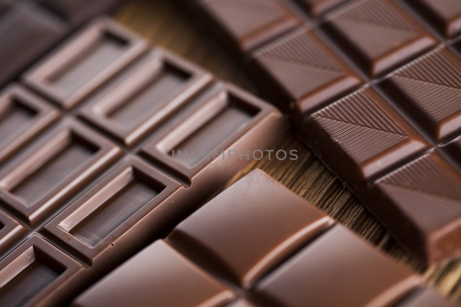 Chocolate bar, candy sweet, dessert food on wooden background by JanPietruszka