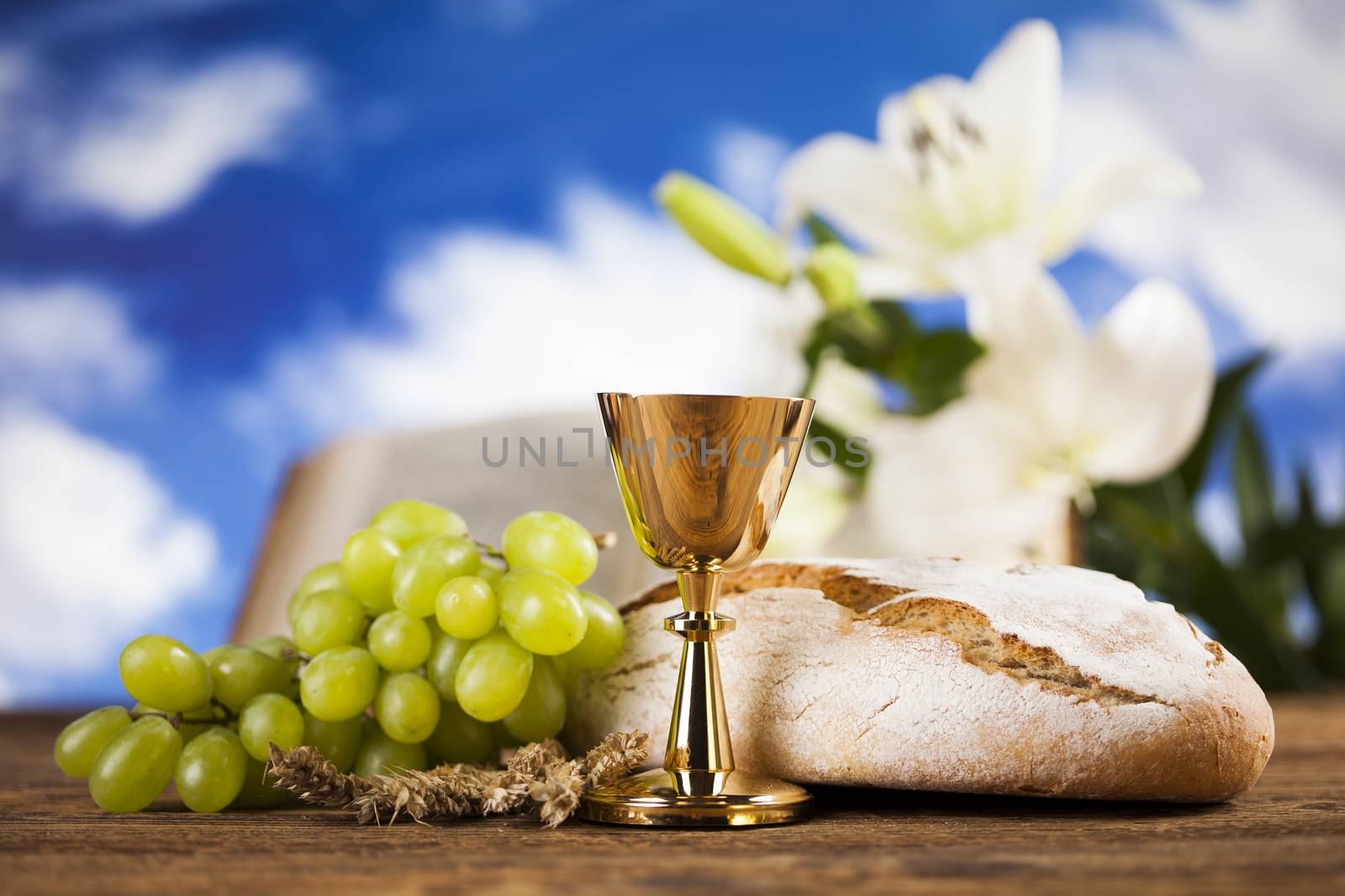 Symbol christianity religion a golden chalice with grapes and br by JanPietruszka