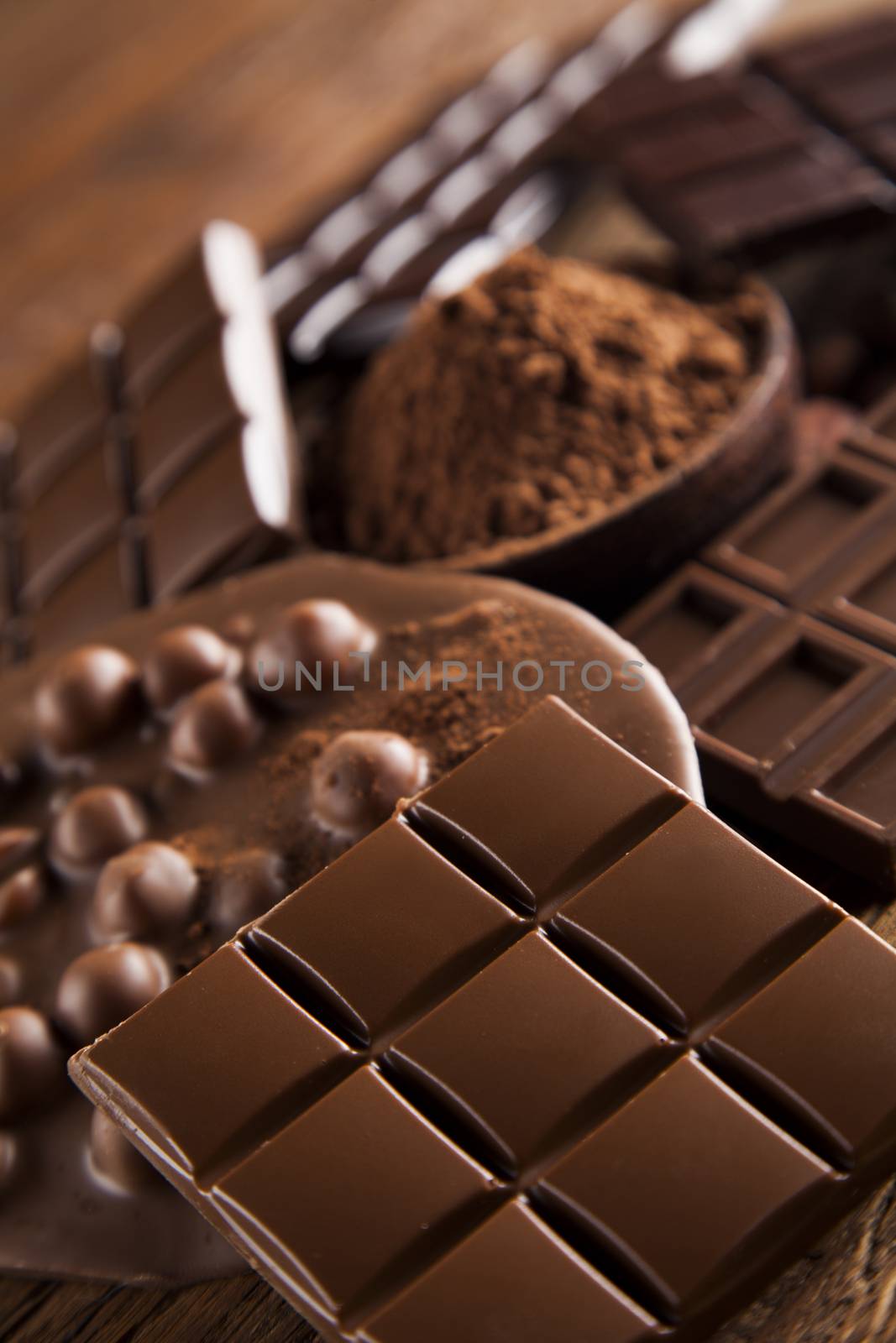 Chocolate bar, candy sweet, dessert food on wooden background by JanPietruszka