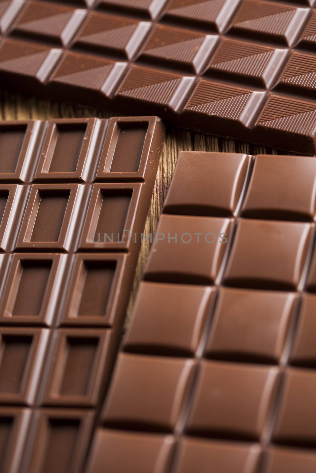 Bars Chocolate , candy sweet, dessert food on wooden background