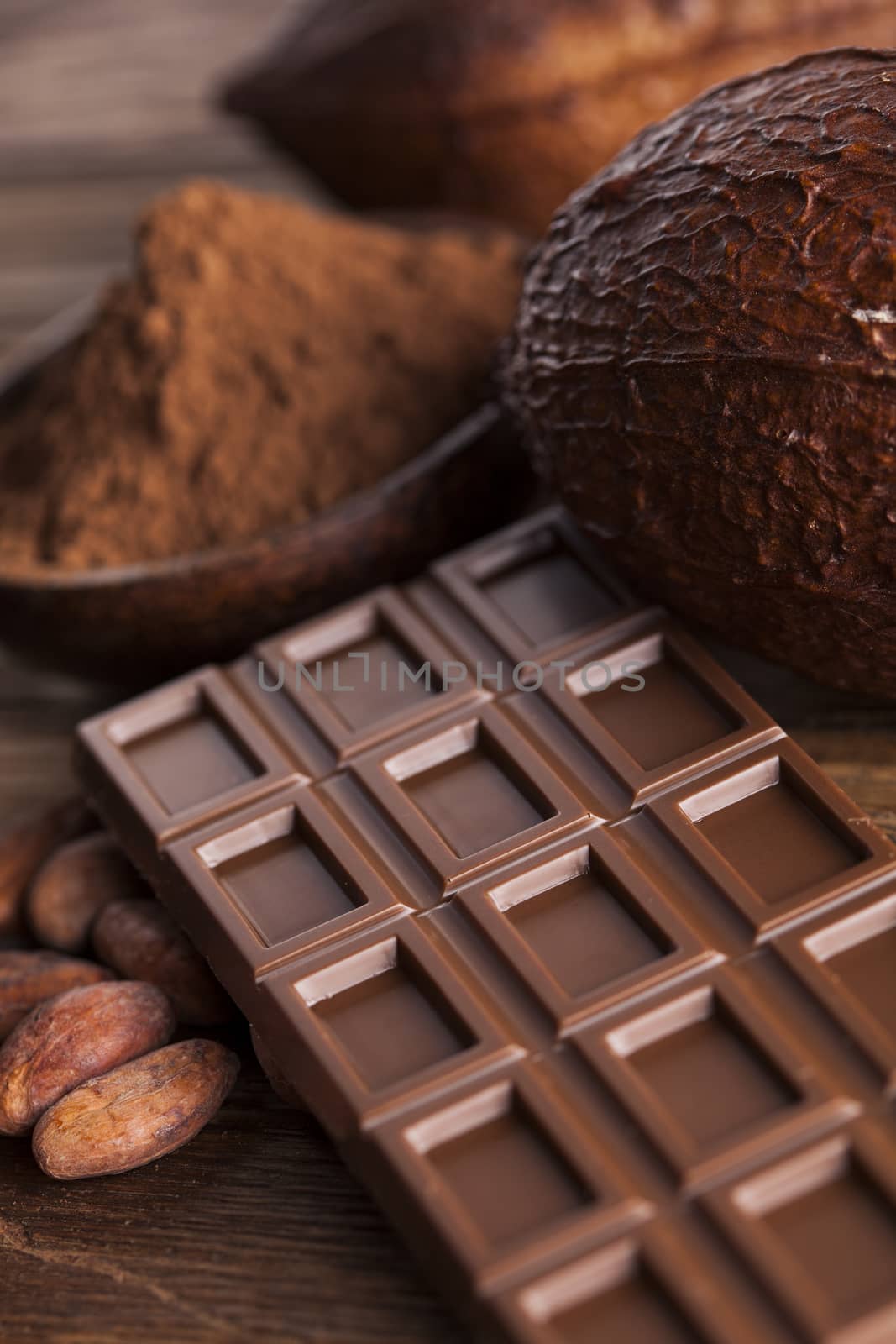 Cocoa pod and chocolate bar and food dessert background by JanPietruszka