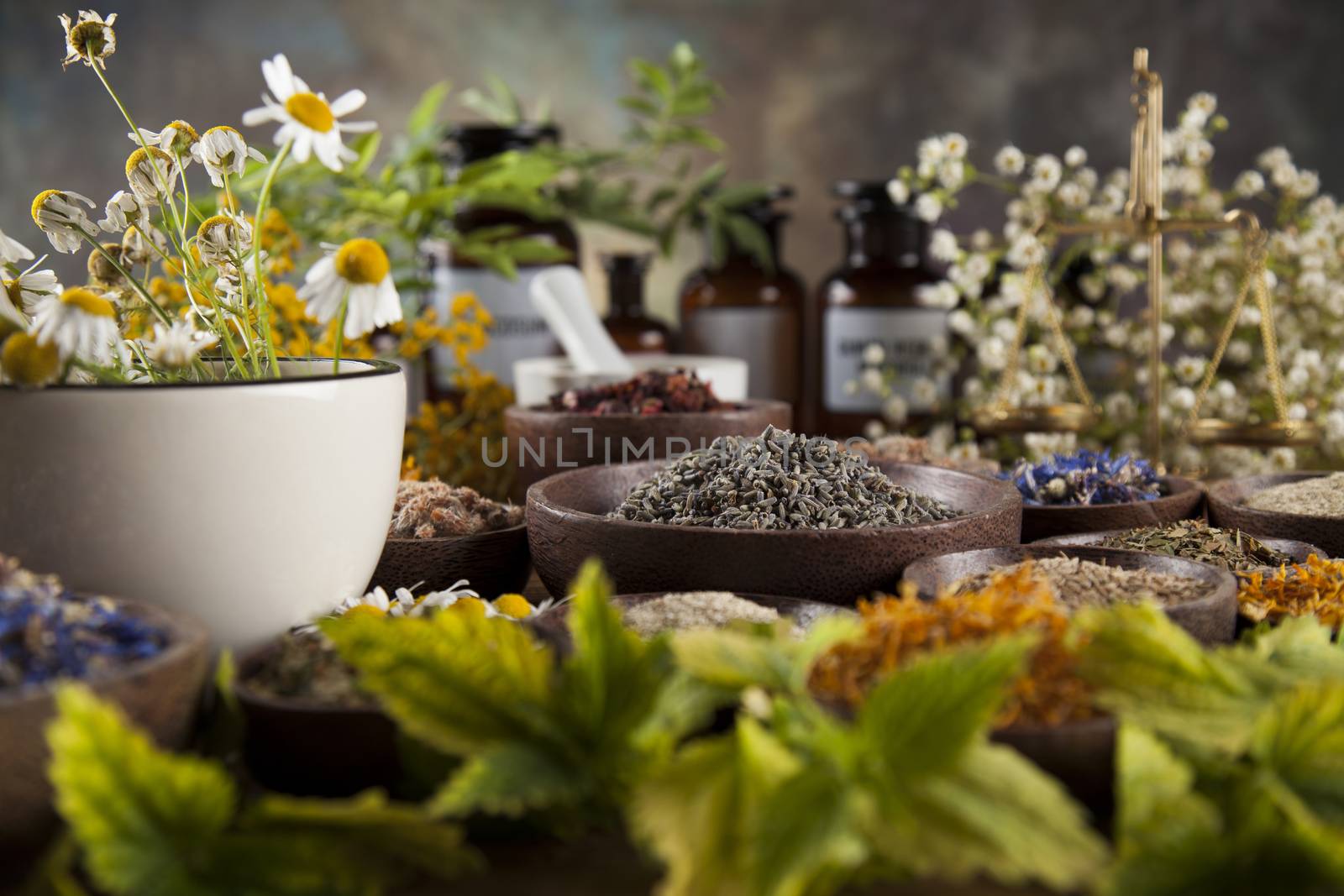 Herbs medicine and vintage wooden desk background by JanPietruszka