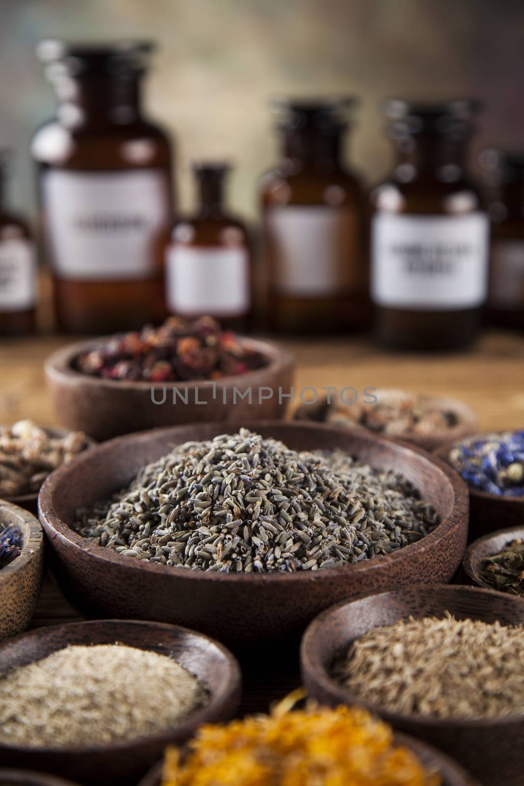 Herbal medicine on wooden desk background by JanPietruszka