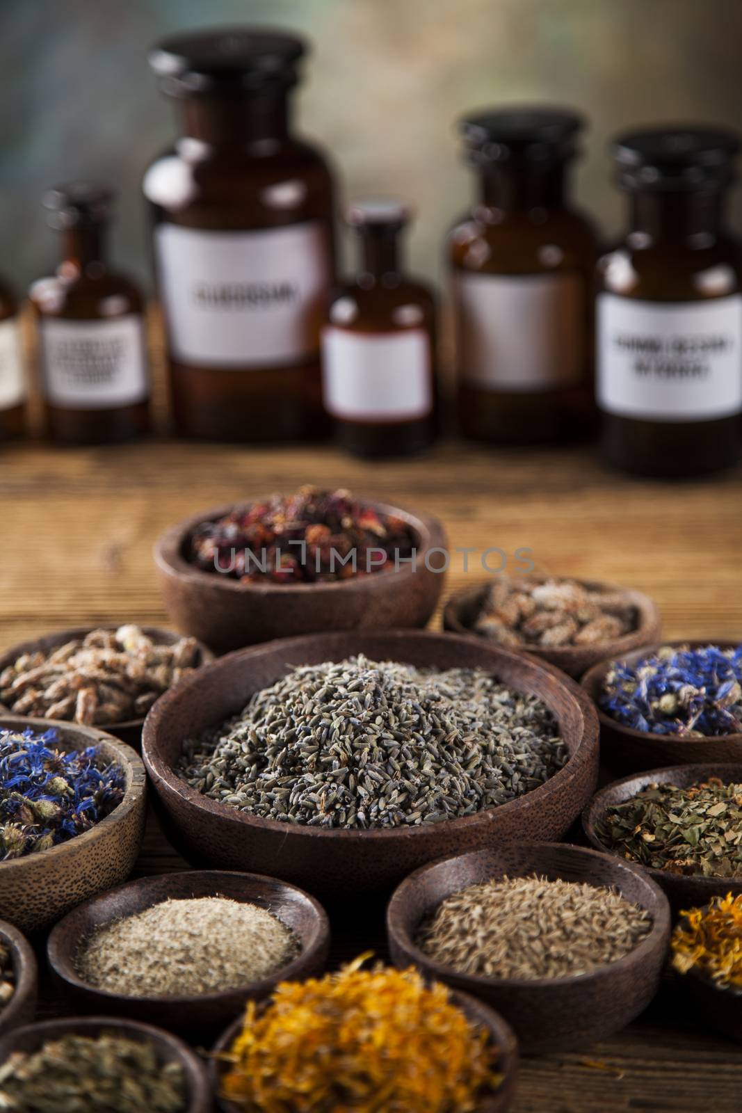Herbs medicine and vintage wooden desk background by JanPietruszka