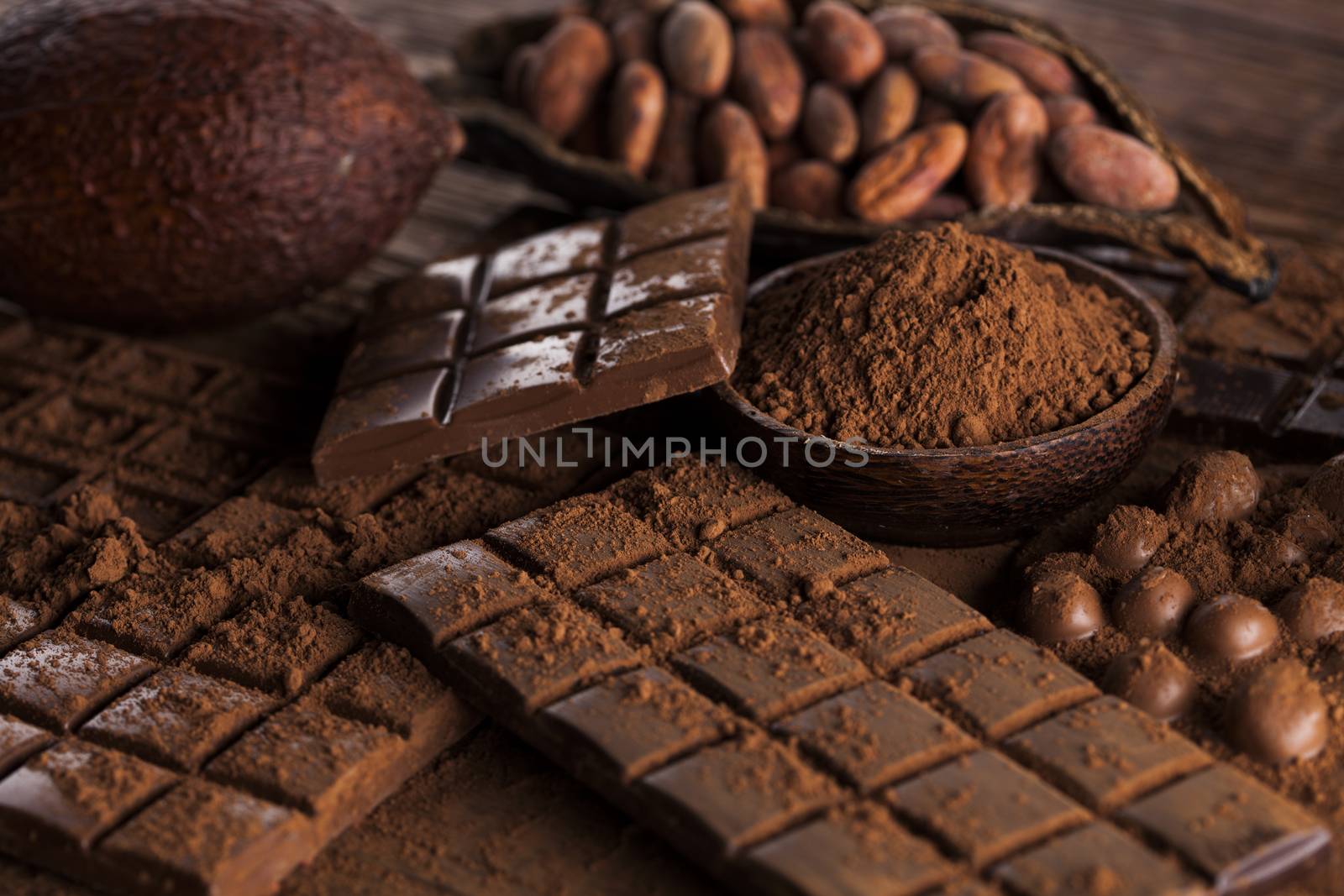 Dark and milk chocolate bar on a wooden table