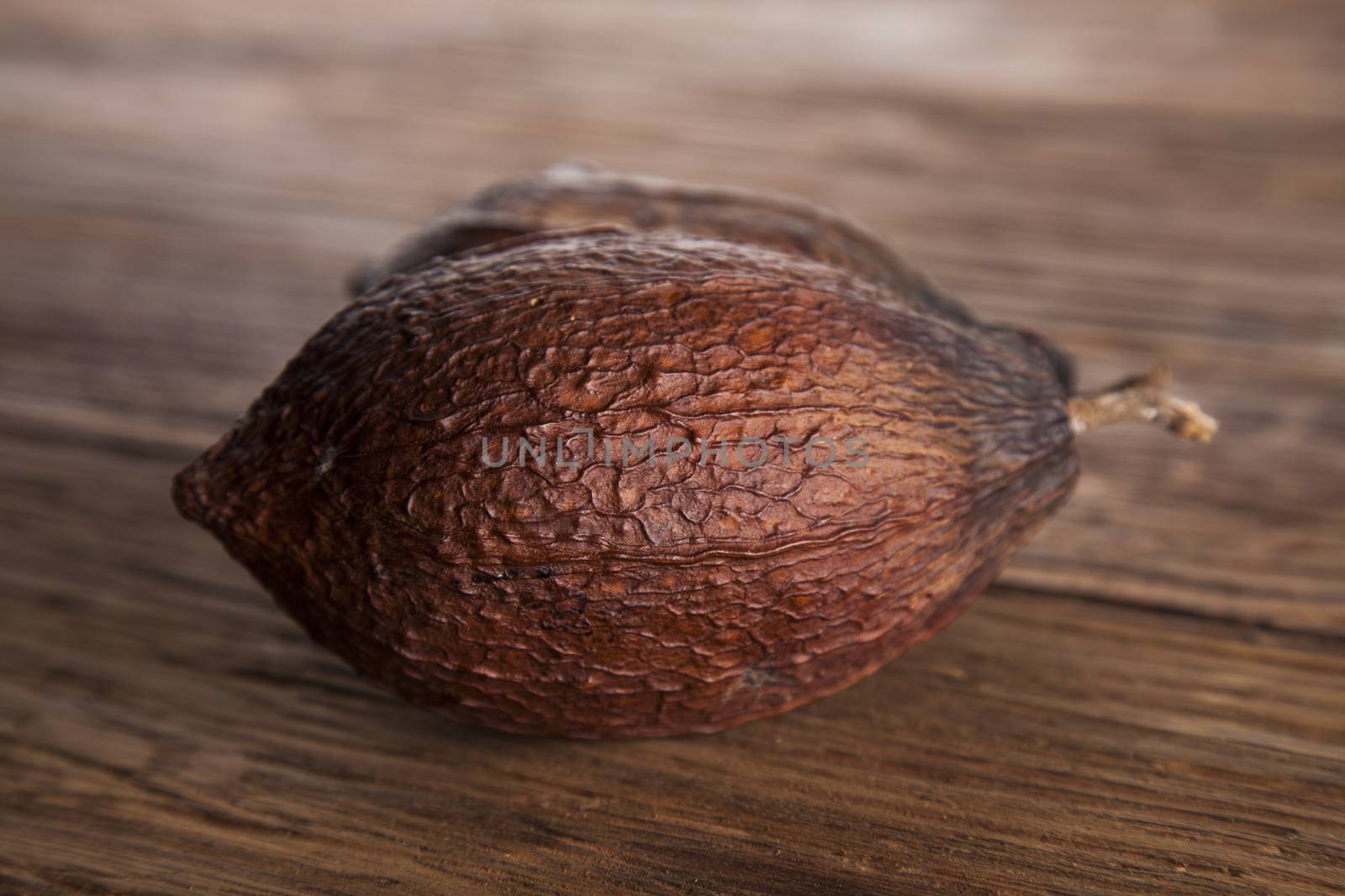 Cocoa pod on wooden table by JanPietruszka