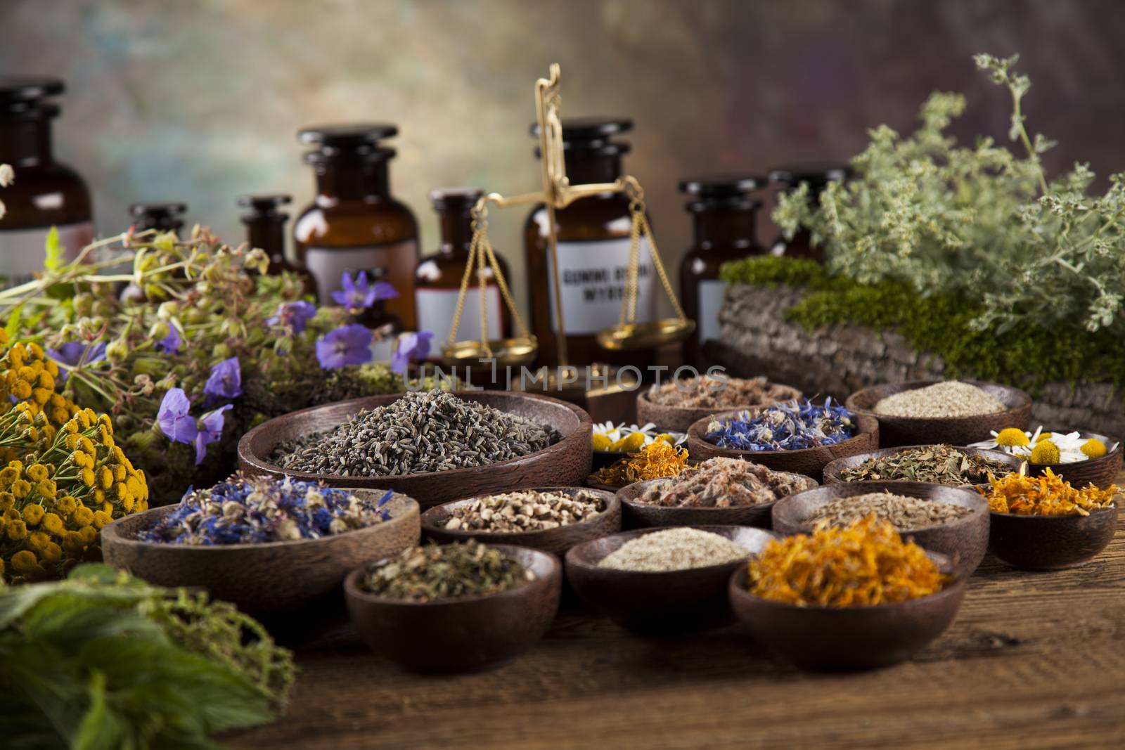 Herbal medicine on wooden desk background by JanPietruszka