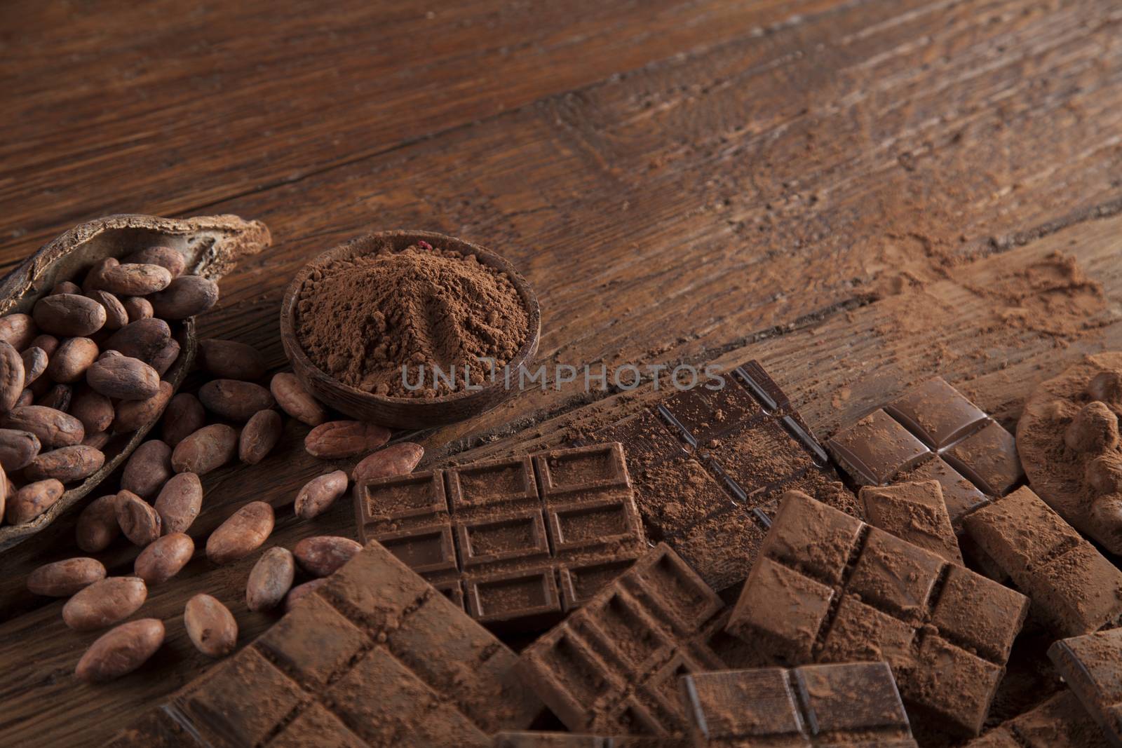 Dark and milk chocolate bar on a wooden table