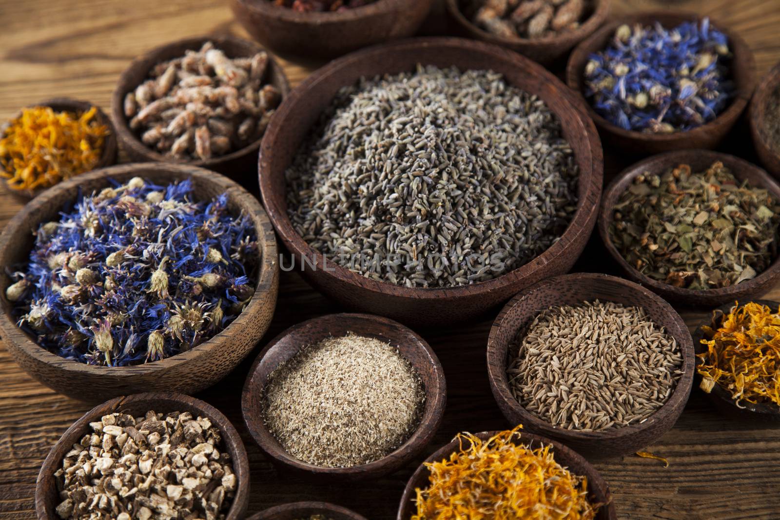 Herbs medicine and vintage wooden desk background by JanPietruszka