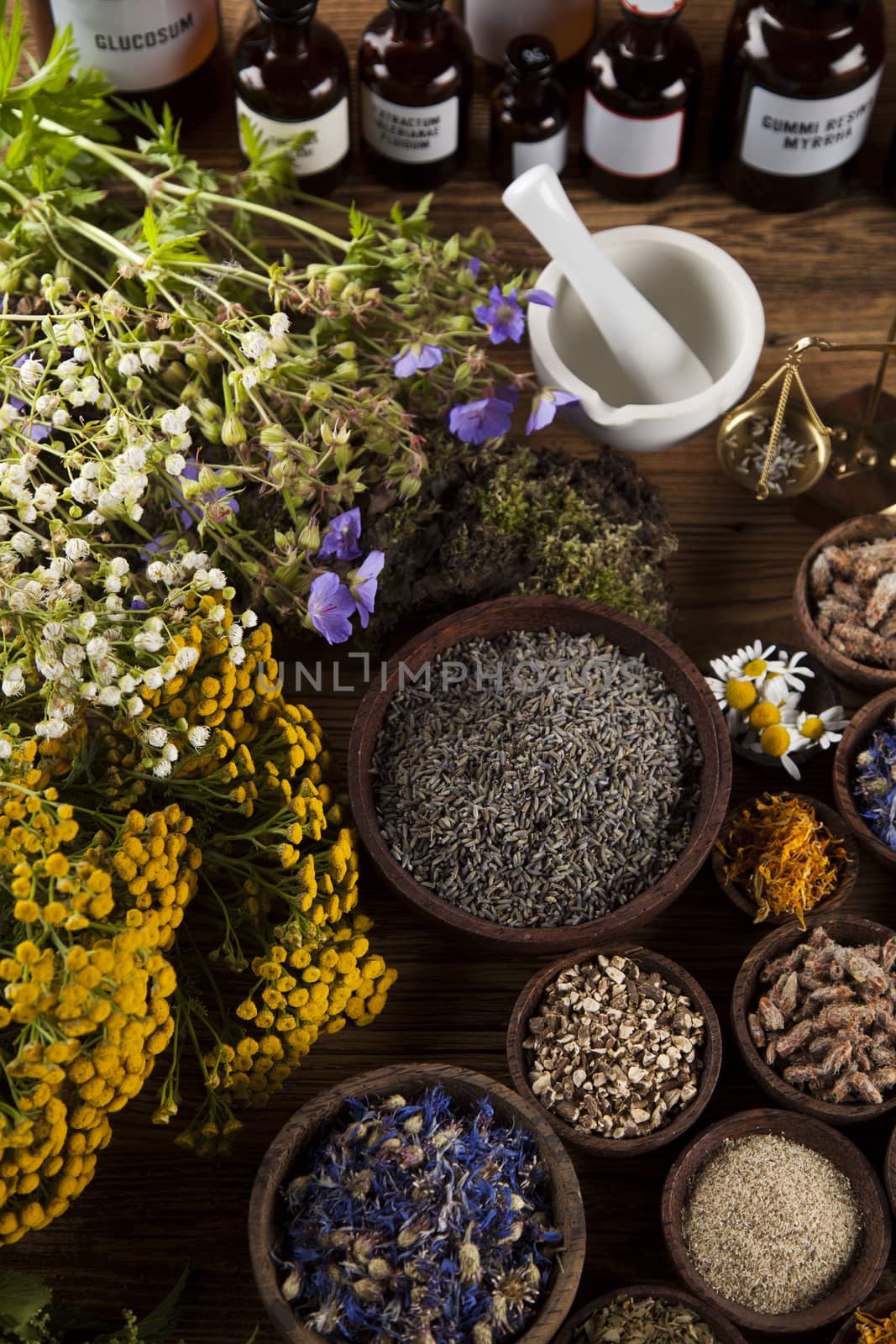 Natural medicine on wooden table background by JanPietruszka