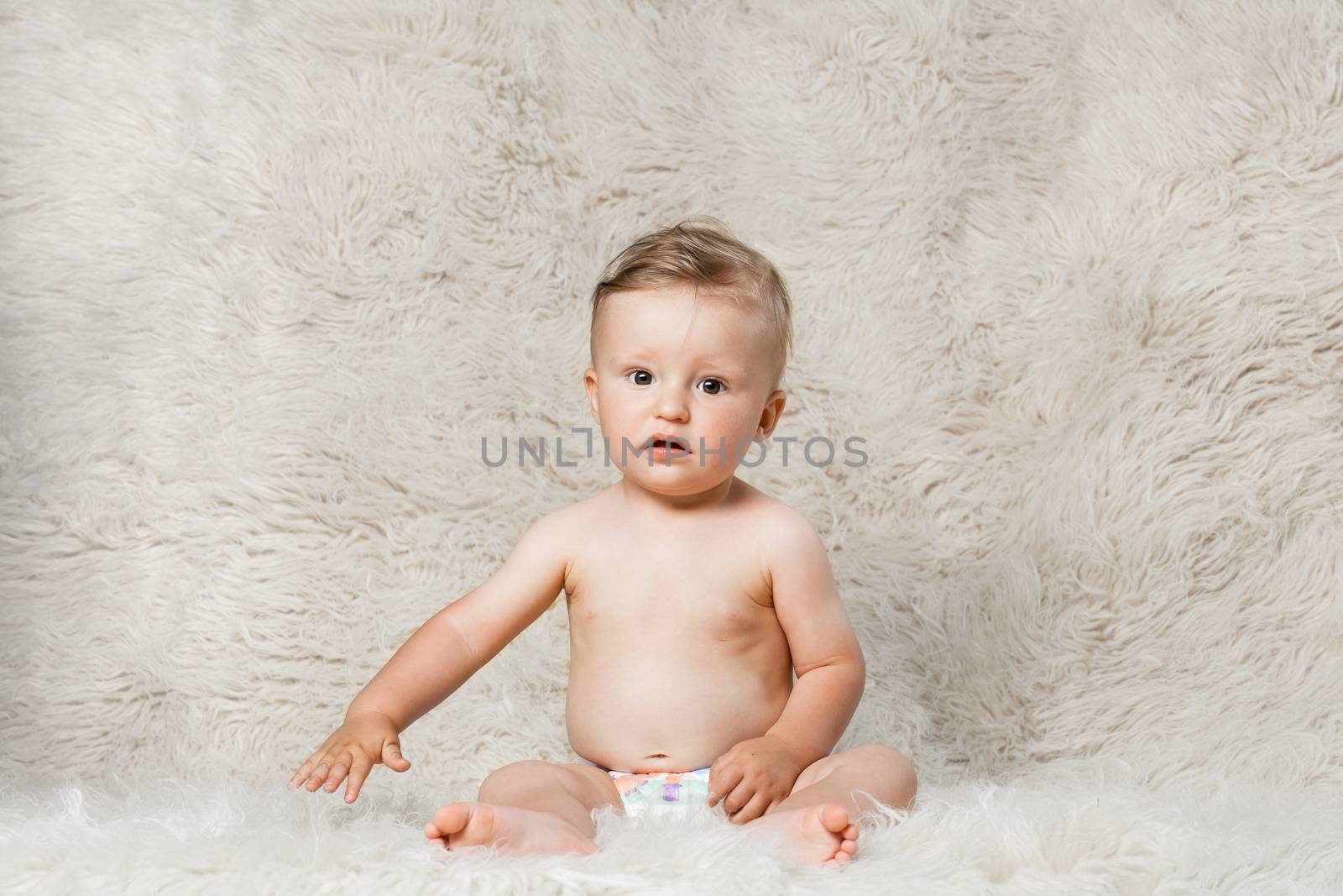 baby boy on shaggy woolen homemade blanket by kokimk