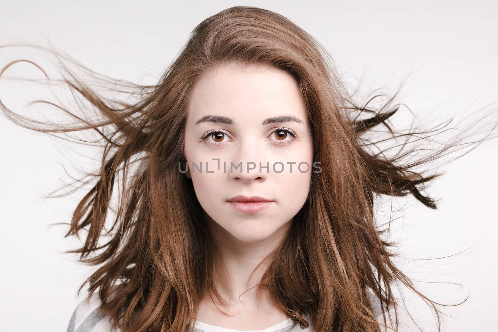 portrait of a beautiful girl with waving hair