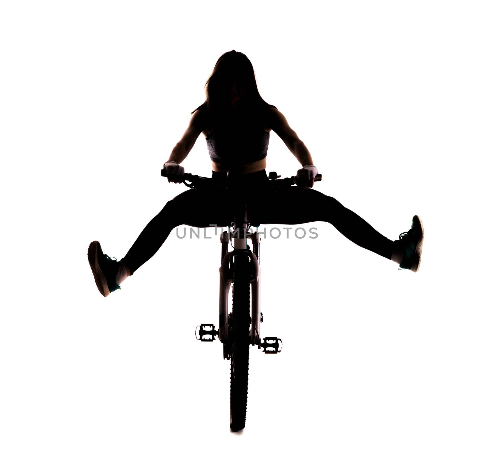 silhouette girl posing on a mountainbike against white background