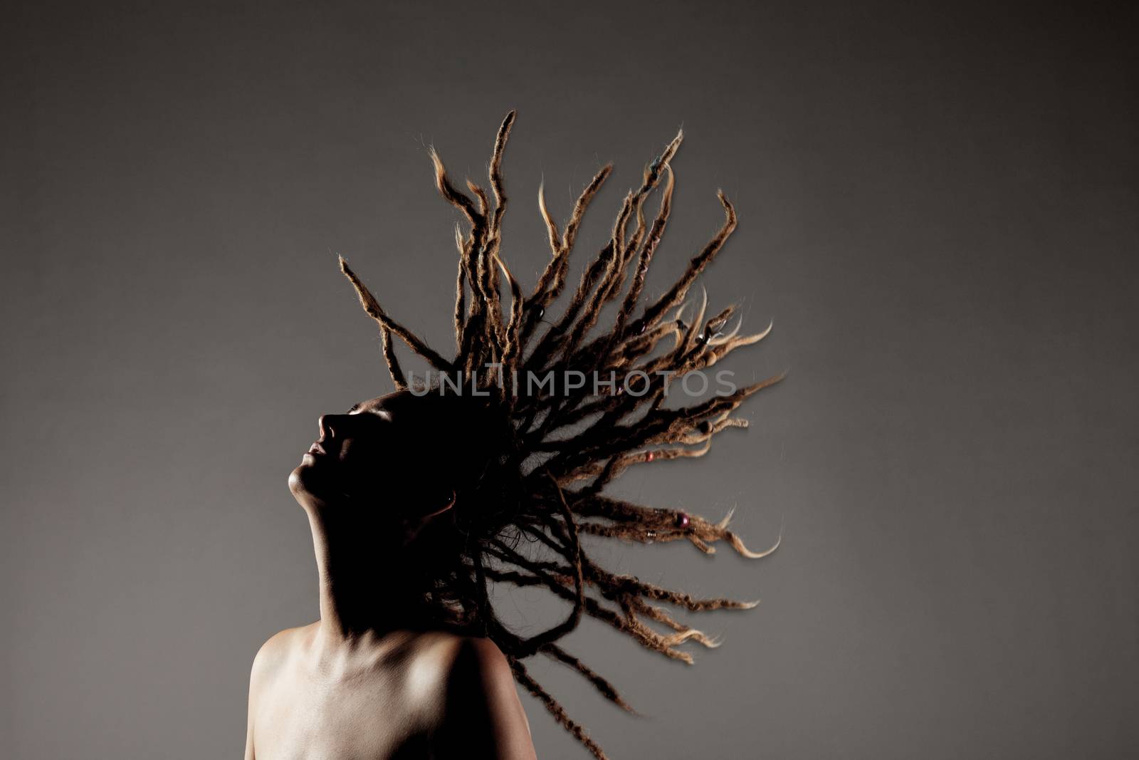 girl with dreadlocks in the air by kokimk