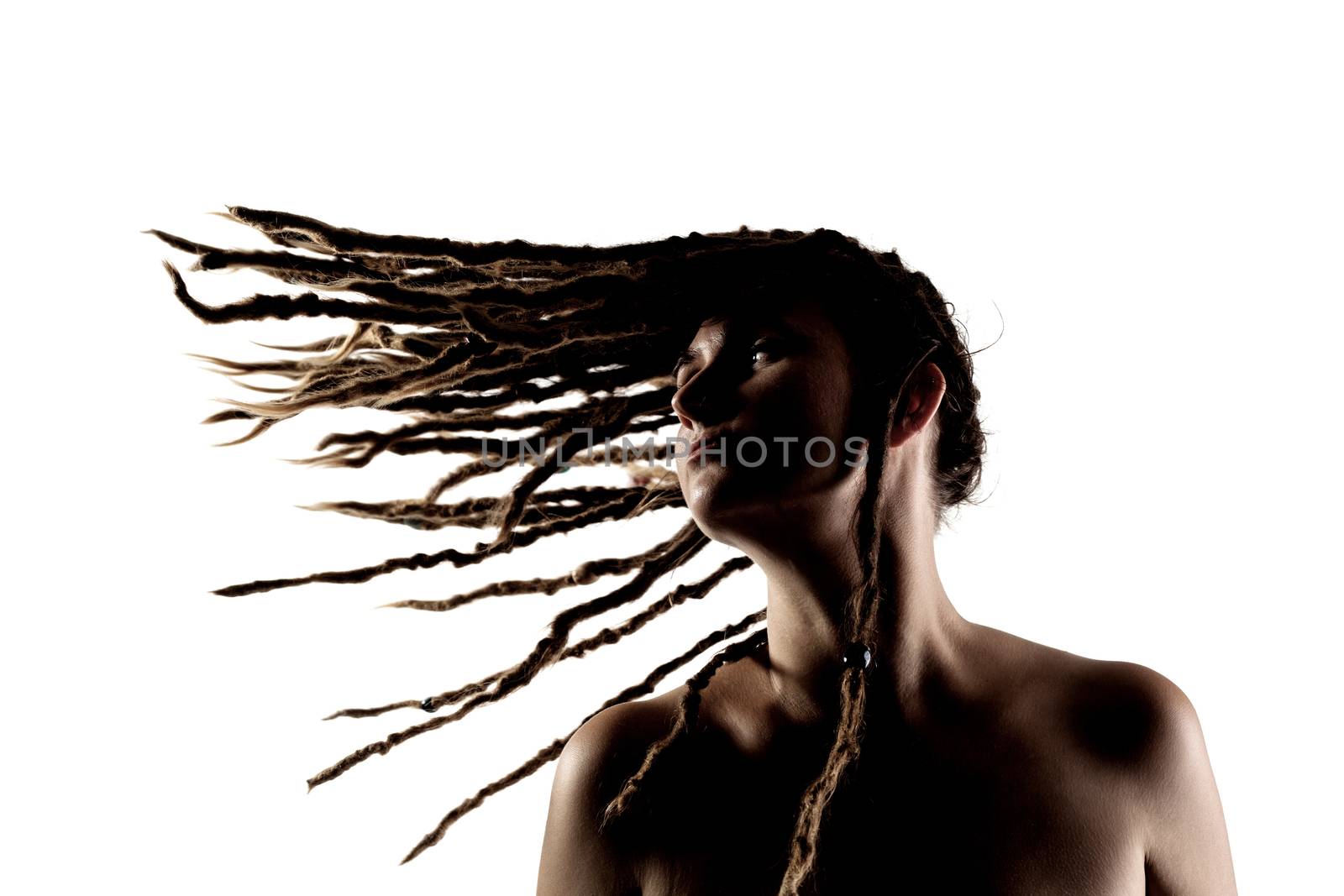 portrait of a caucasian girl with dreadlocks flying in the air