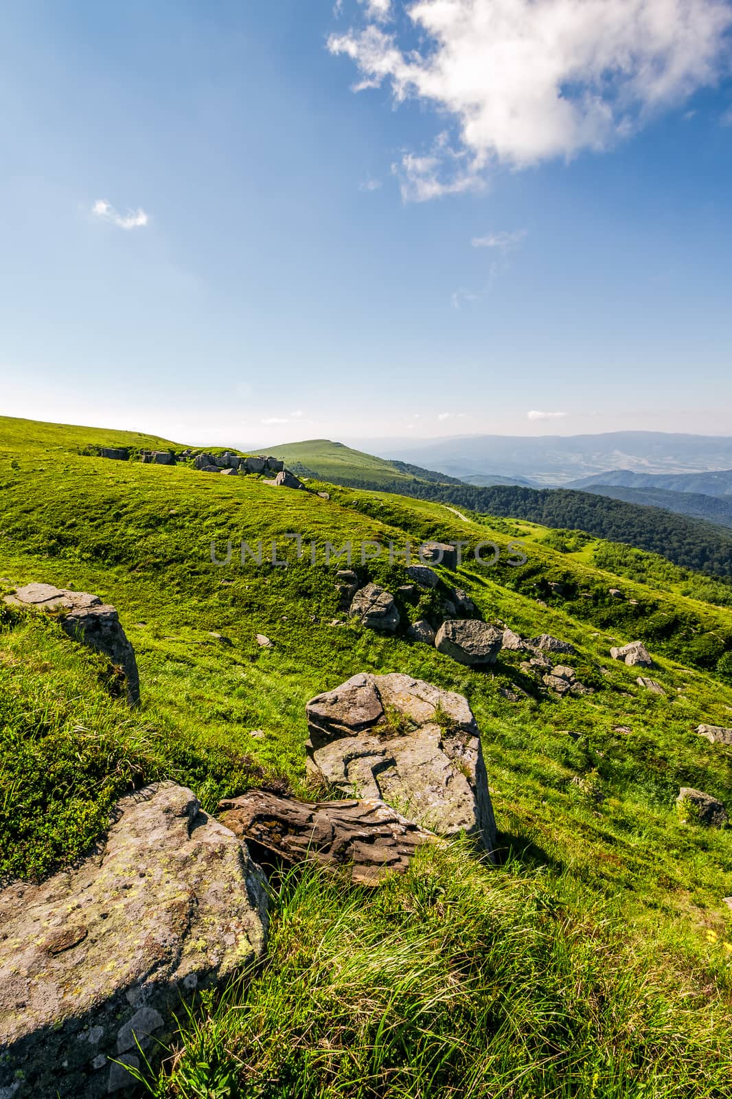 huge boulders on the edge of hillside by Pellinni