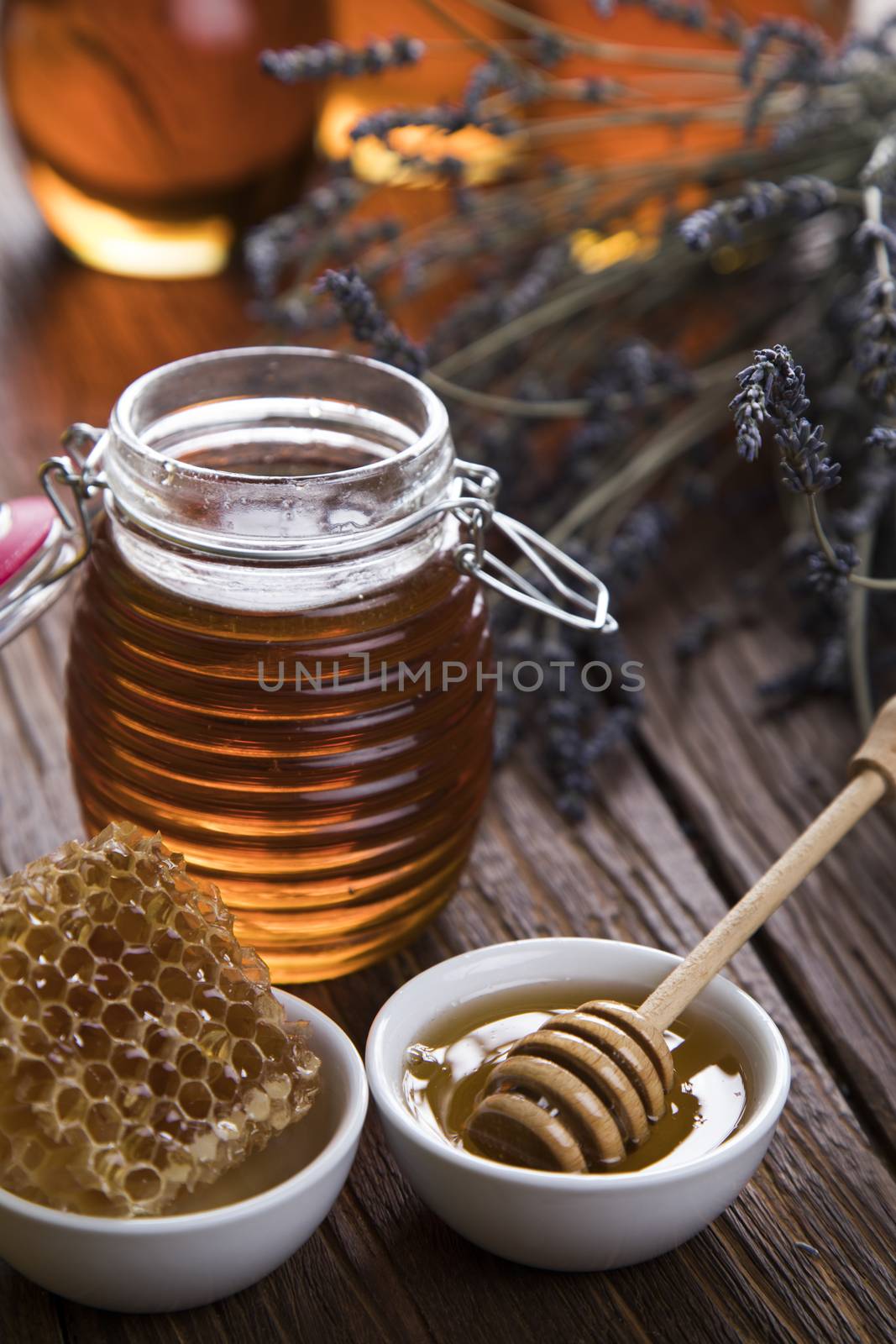 Jar of honey with honeycomb