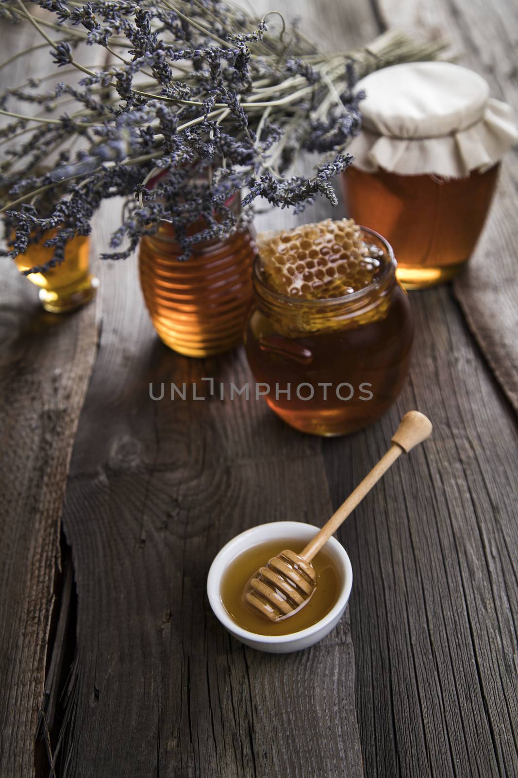 Jar of honey with honeycomb