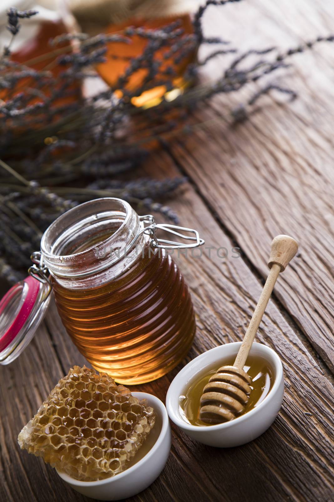 Jar of honey with honeycomb