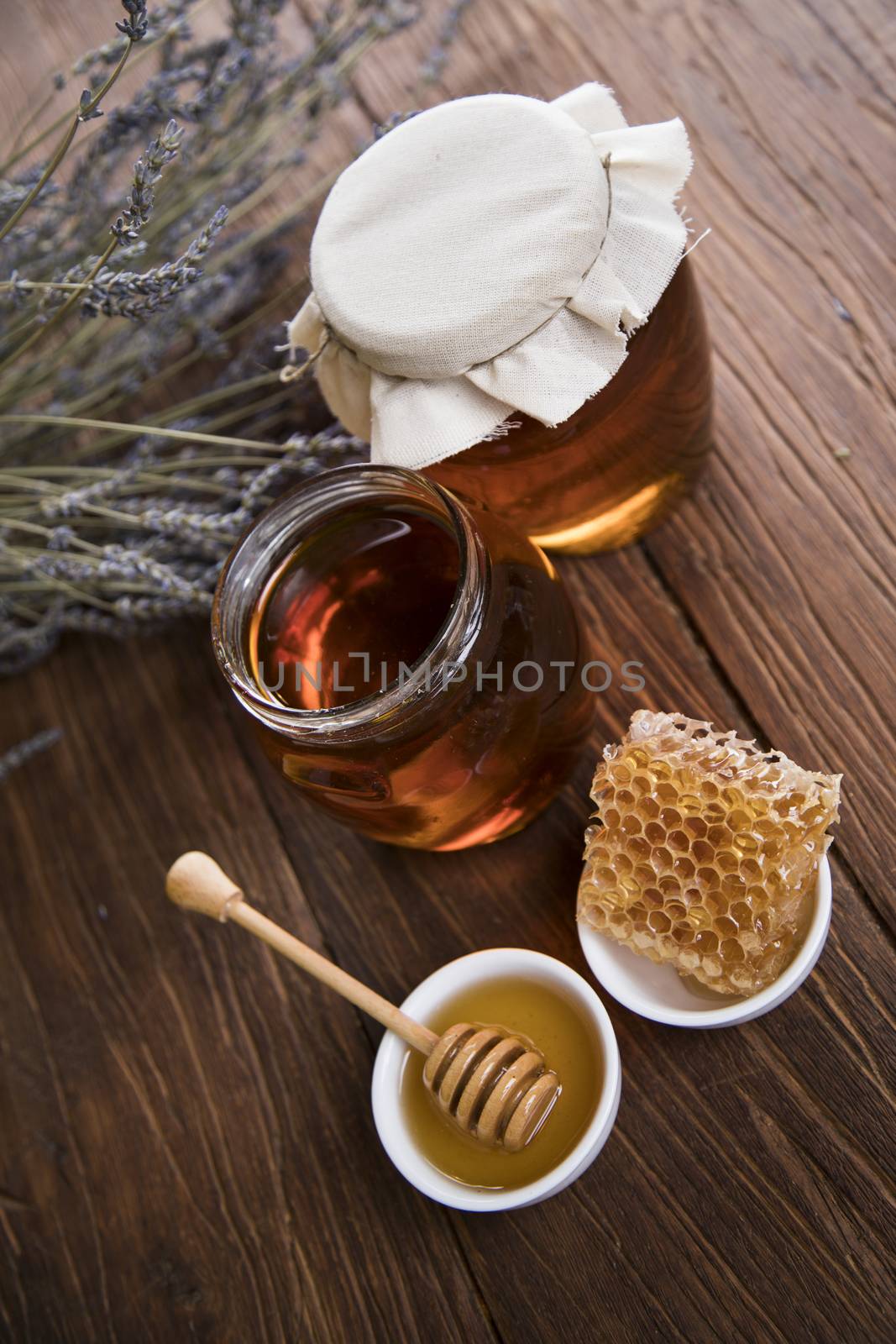 Sweet honey in the comb, glass jar by JanPietruszka