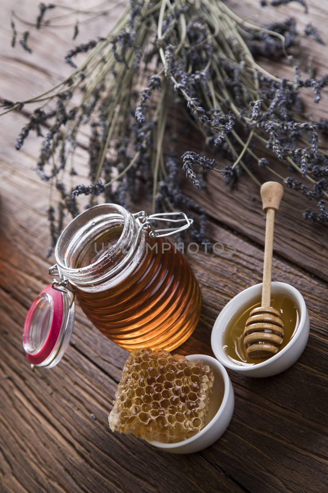 Jar full of fresh honey and honeycombs