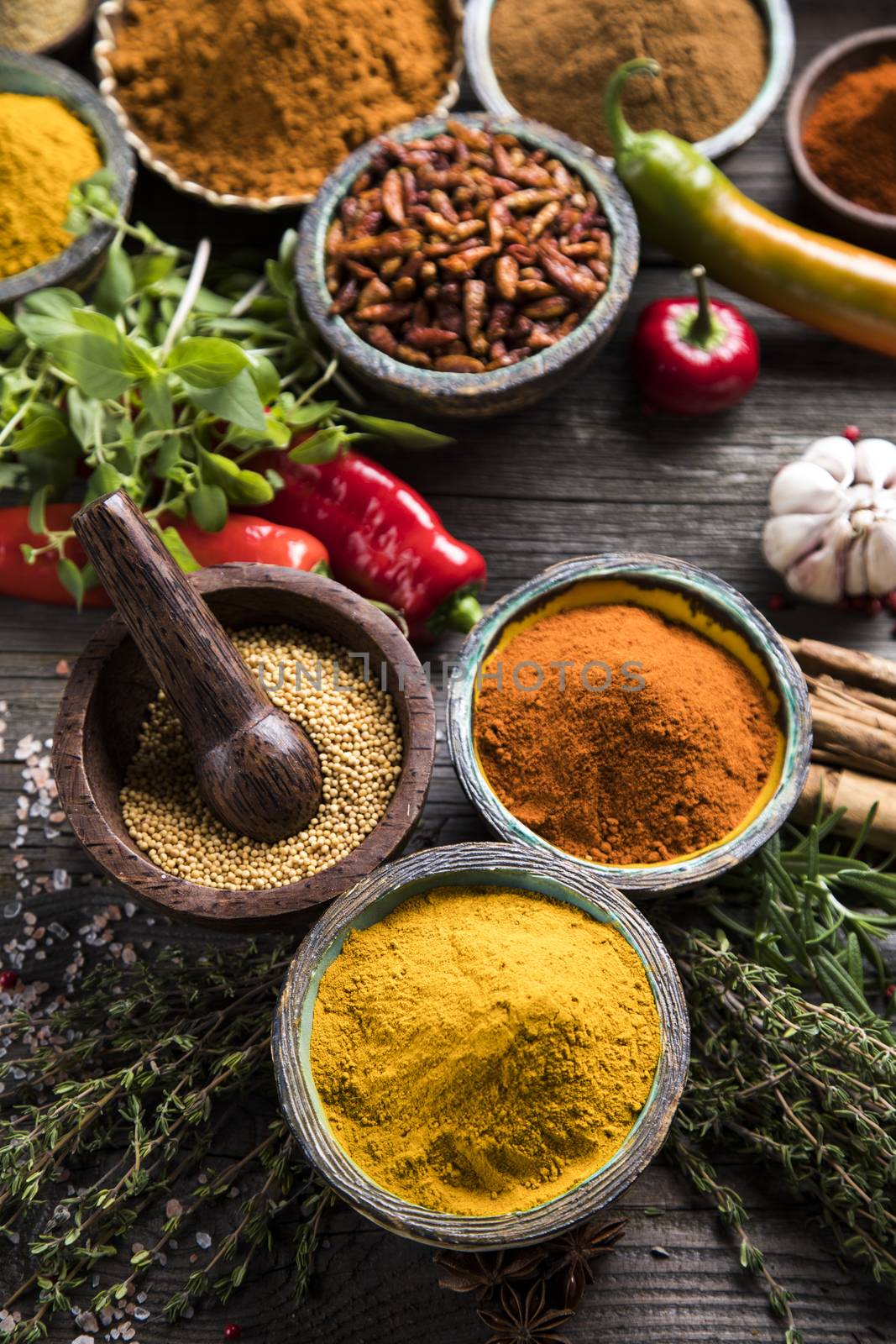 Variety of spices and herbs on kitchen table