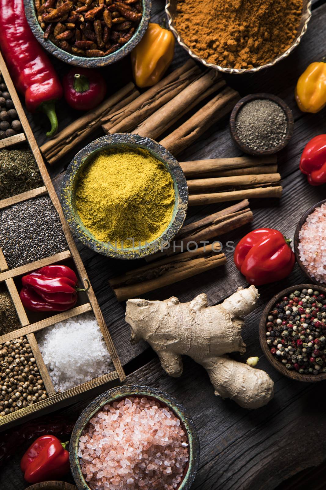 Wooden box with spices and herbs