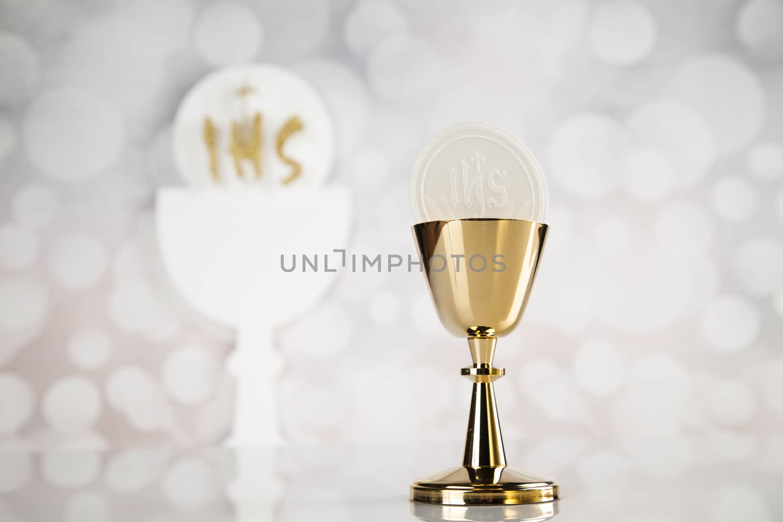 Holy communion a golden chalice, composition isolated on white