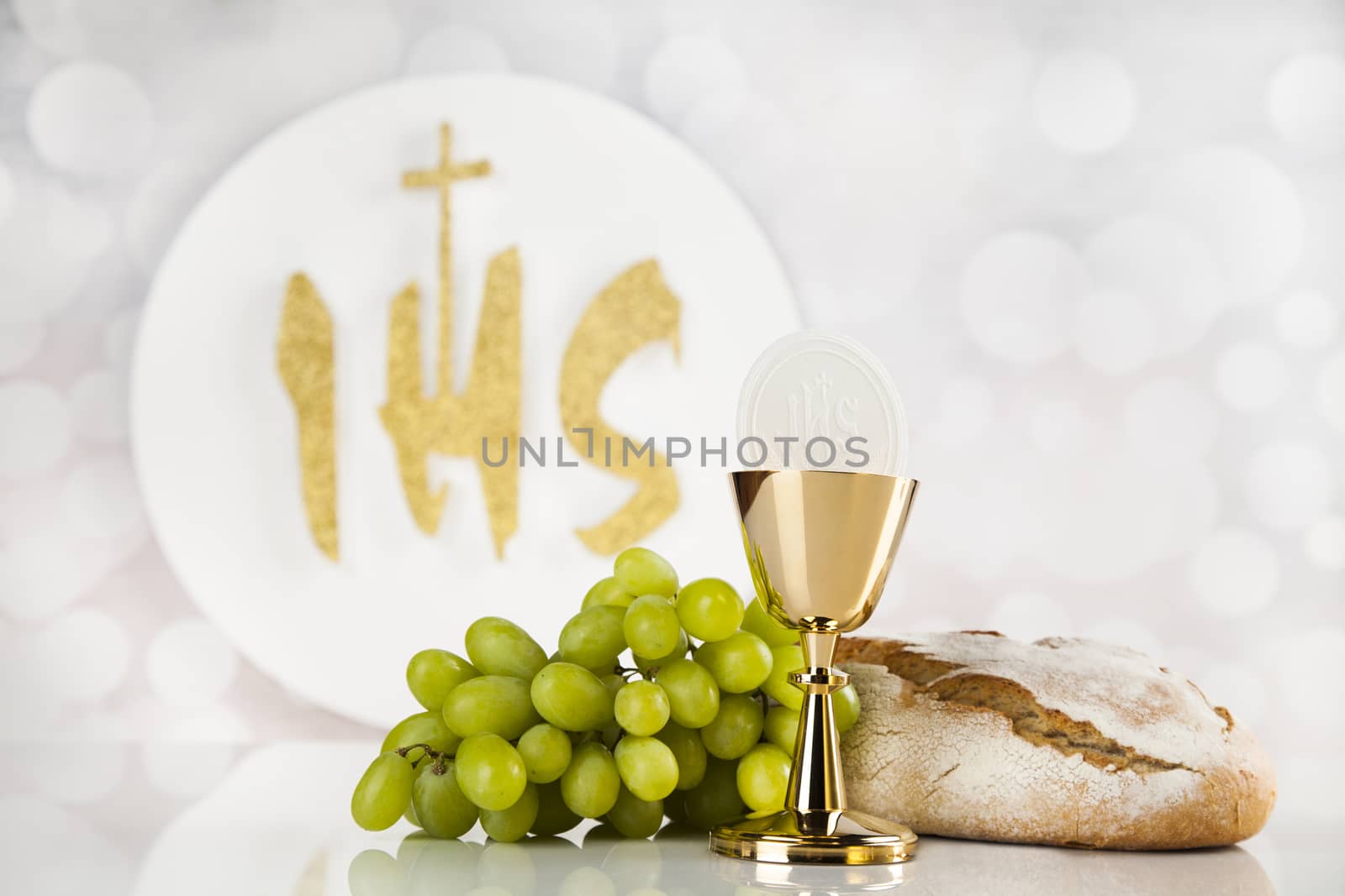 Holy communion a golden chalice, composition isolated on white