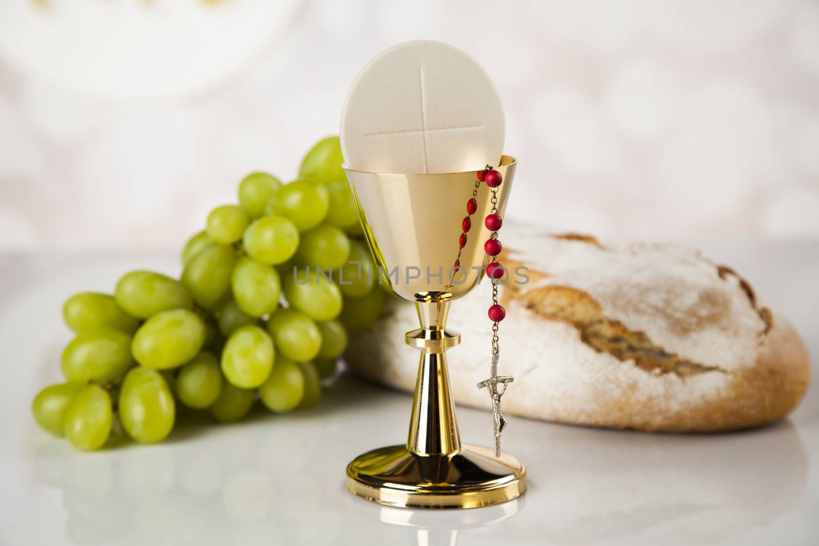 Holy communion a golden chalice, composition isolated on white by JanPietruszka