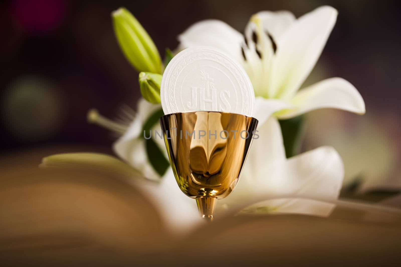 Holy communion a golden chalice with grapes and bread wafers by JanPietruszka